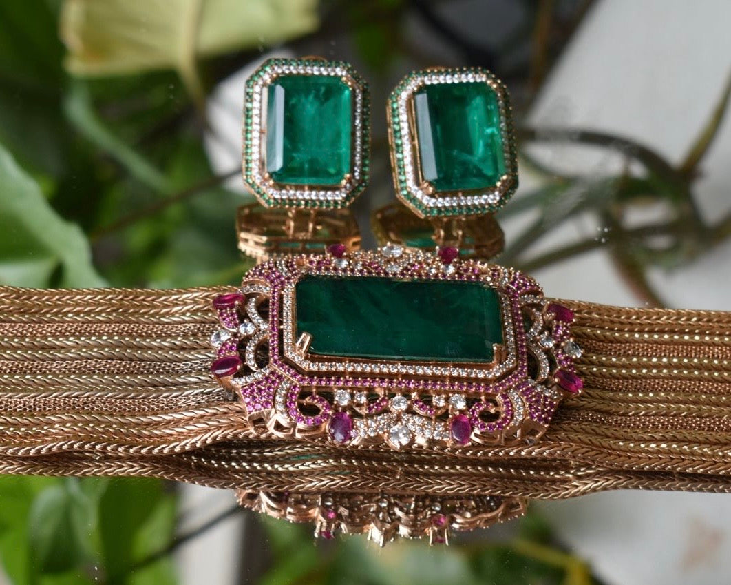 Side-angle detail of emerald necklace showcasing exquisite stone settings