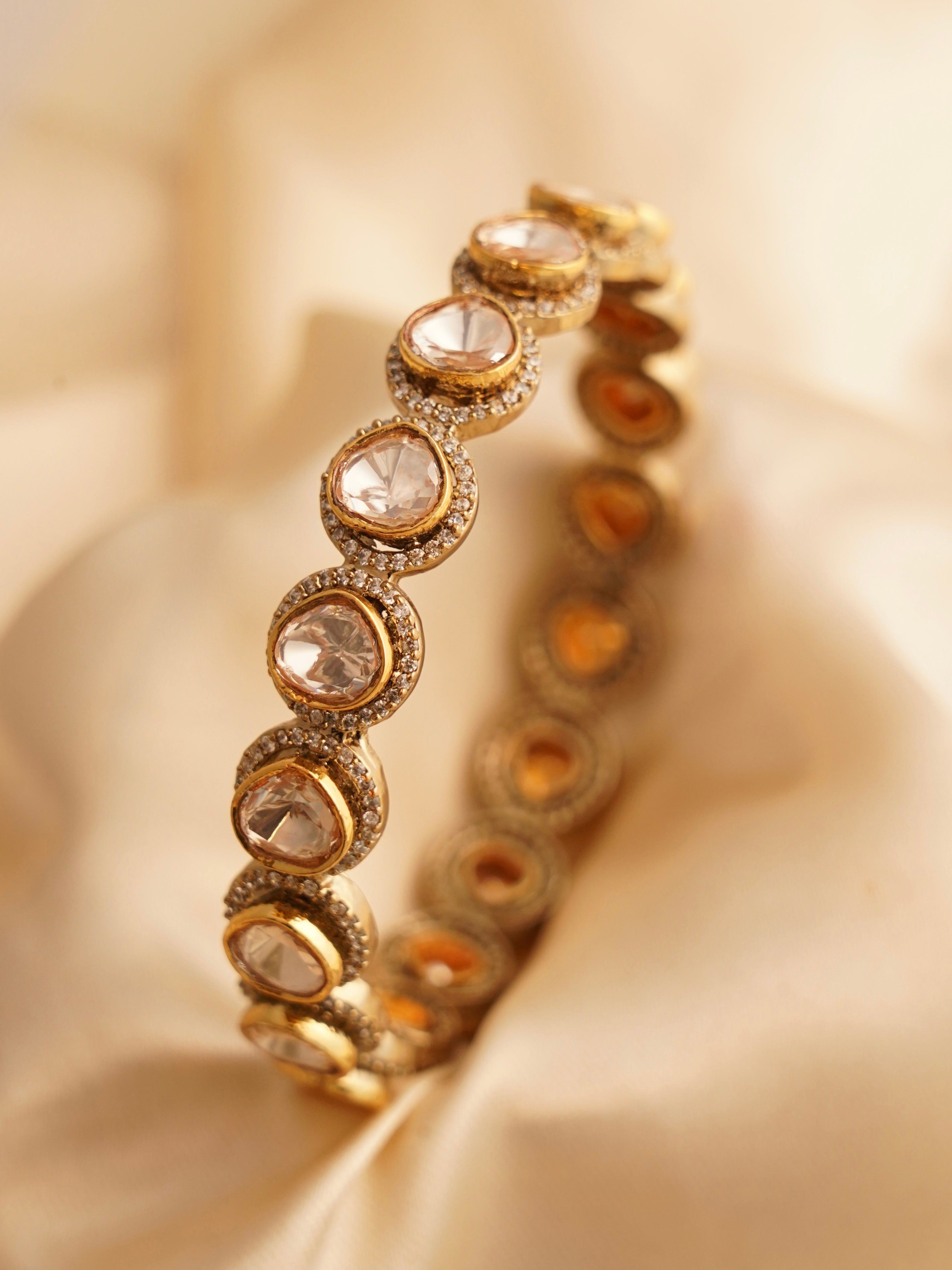 Moissanite diamond bangles in gold-plated finish with non-openable design and intricate sparkle