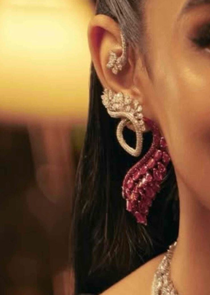 Side profile of diamond-look designer earrings with limited edition styling