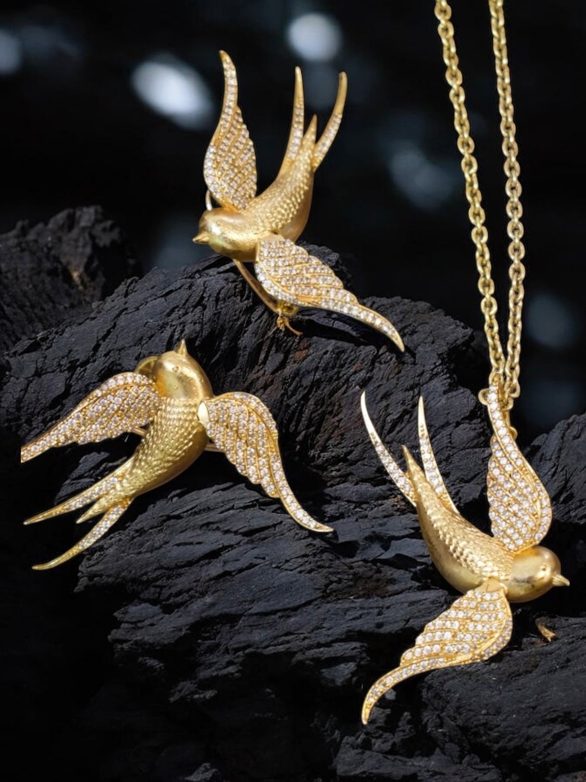 Full view of statement bird set with pendant and clip earrings showcasing bold craftsmanship