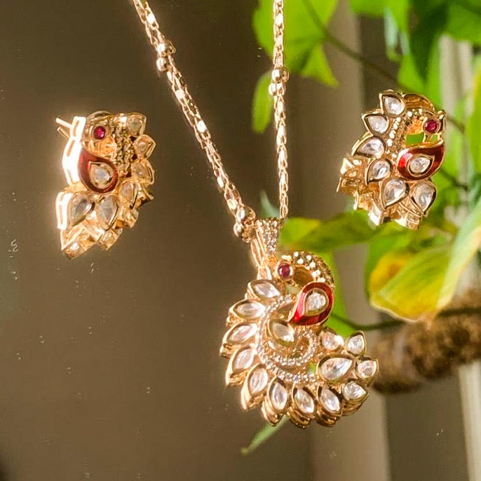 Close-up of enamel work and kundan stones on pendant surface