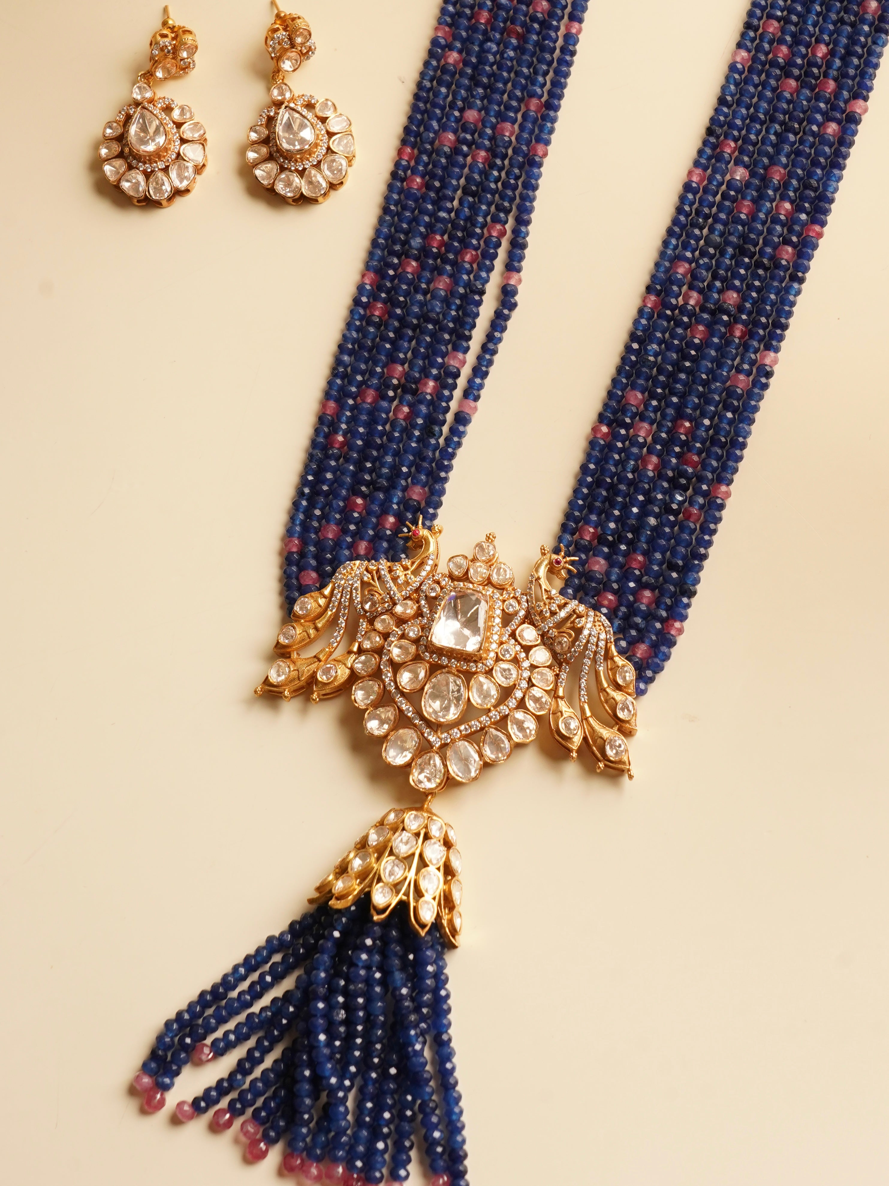 Back view of kundan peacock set showing enamelled finish and chain clasp