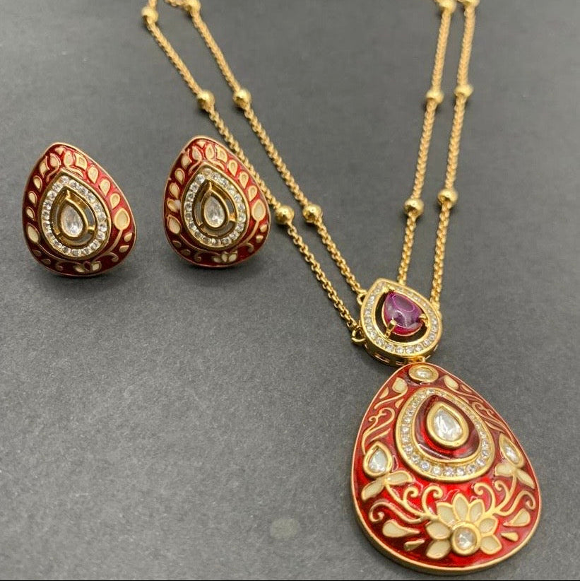 Close-up of meenakari pendant with kundan highlights and detailed enamel artistry