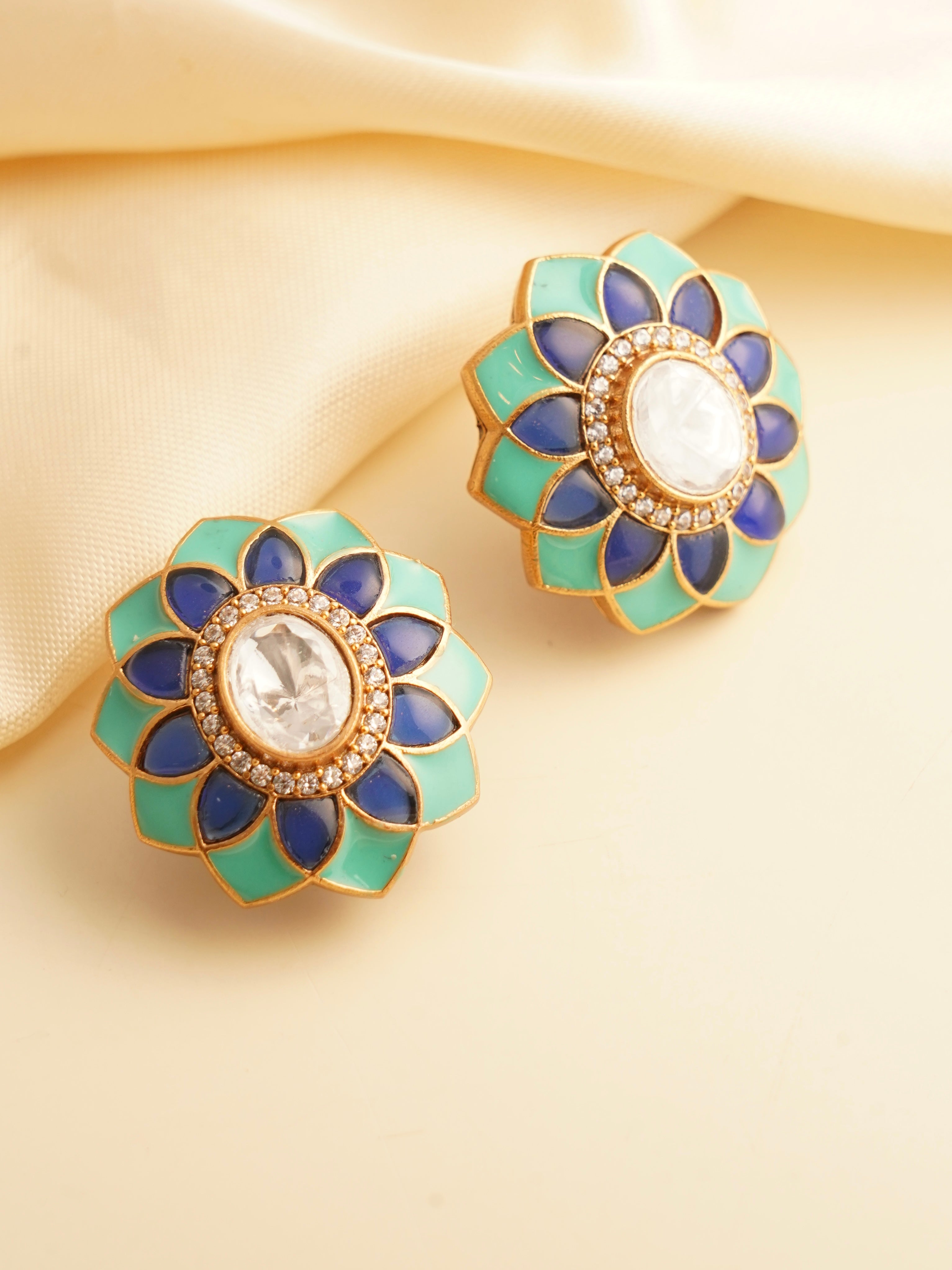 Polki flower studs with turquoise and royal blue enamel petals around a central uncut stone