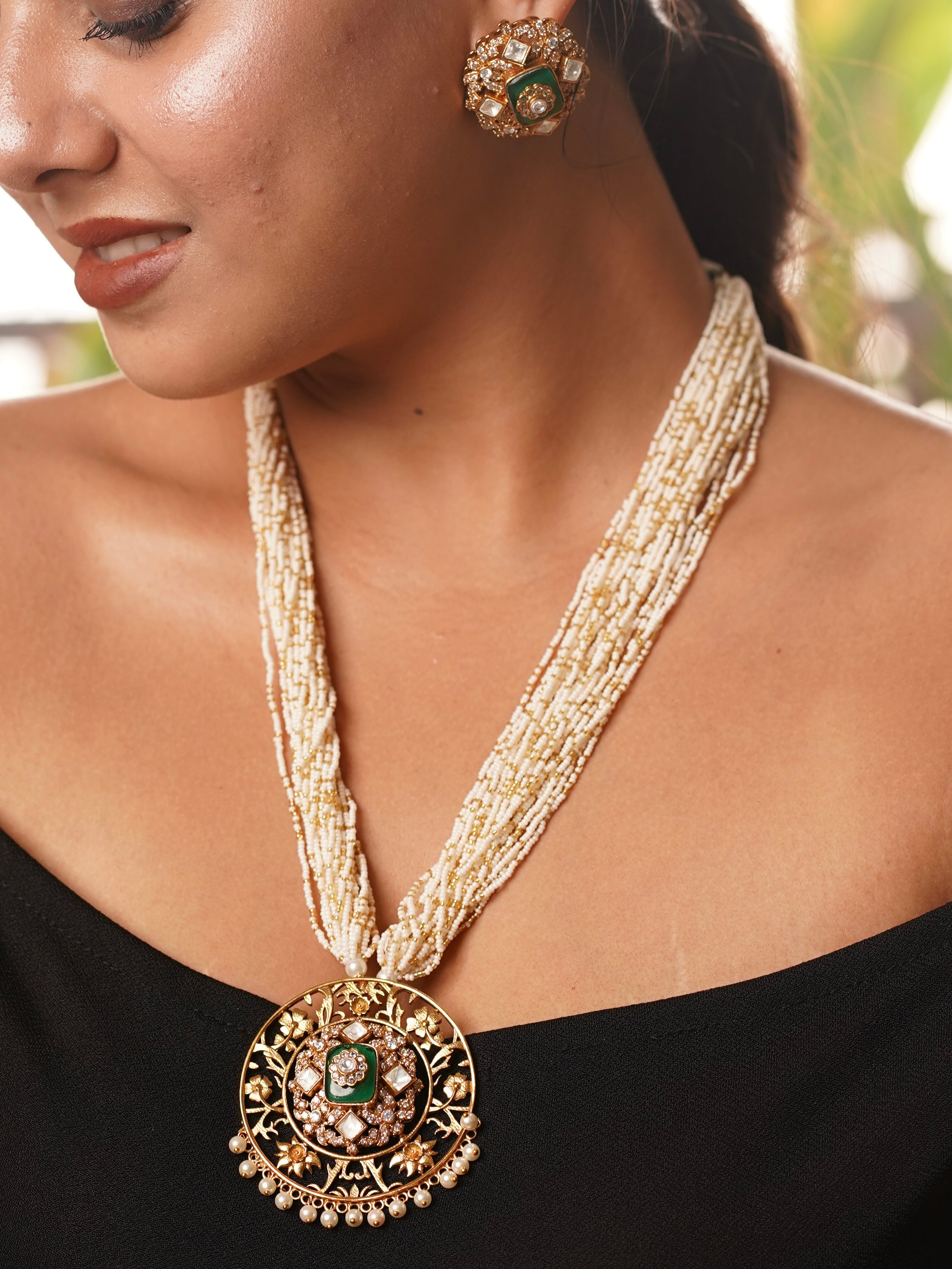 Radhika kundan pearl long necklace with circular pendant, green enamel, and layered pearl strands