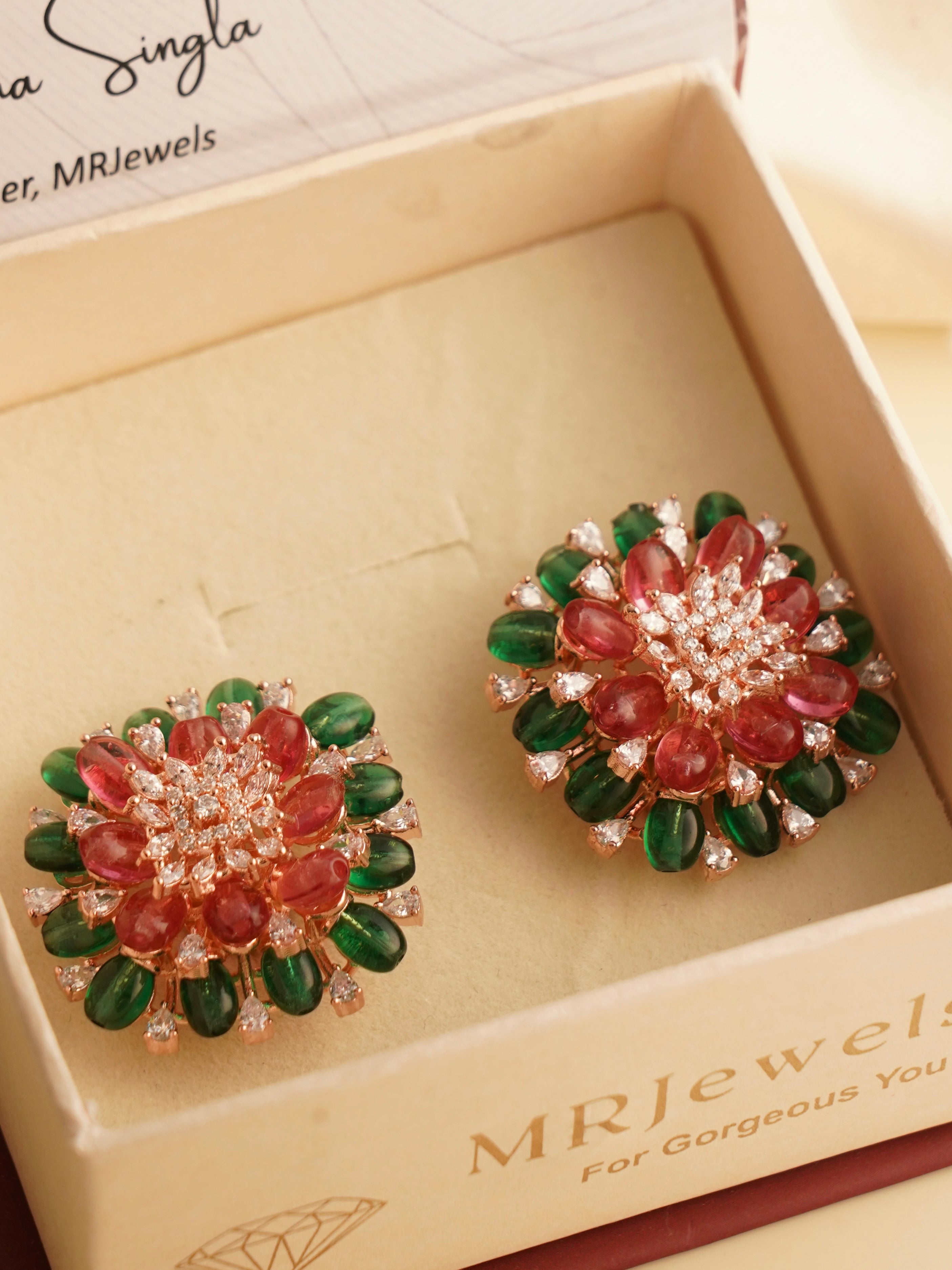 side angle of multicolour beaded earrings with faceted diamond-like stones