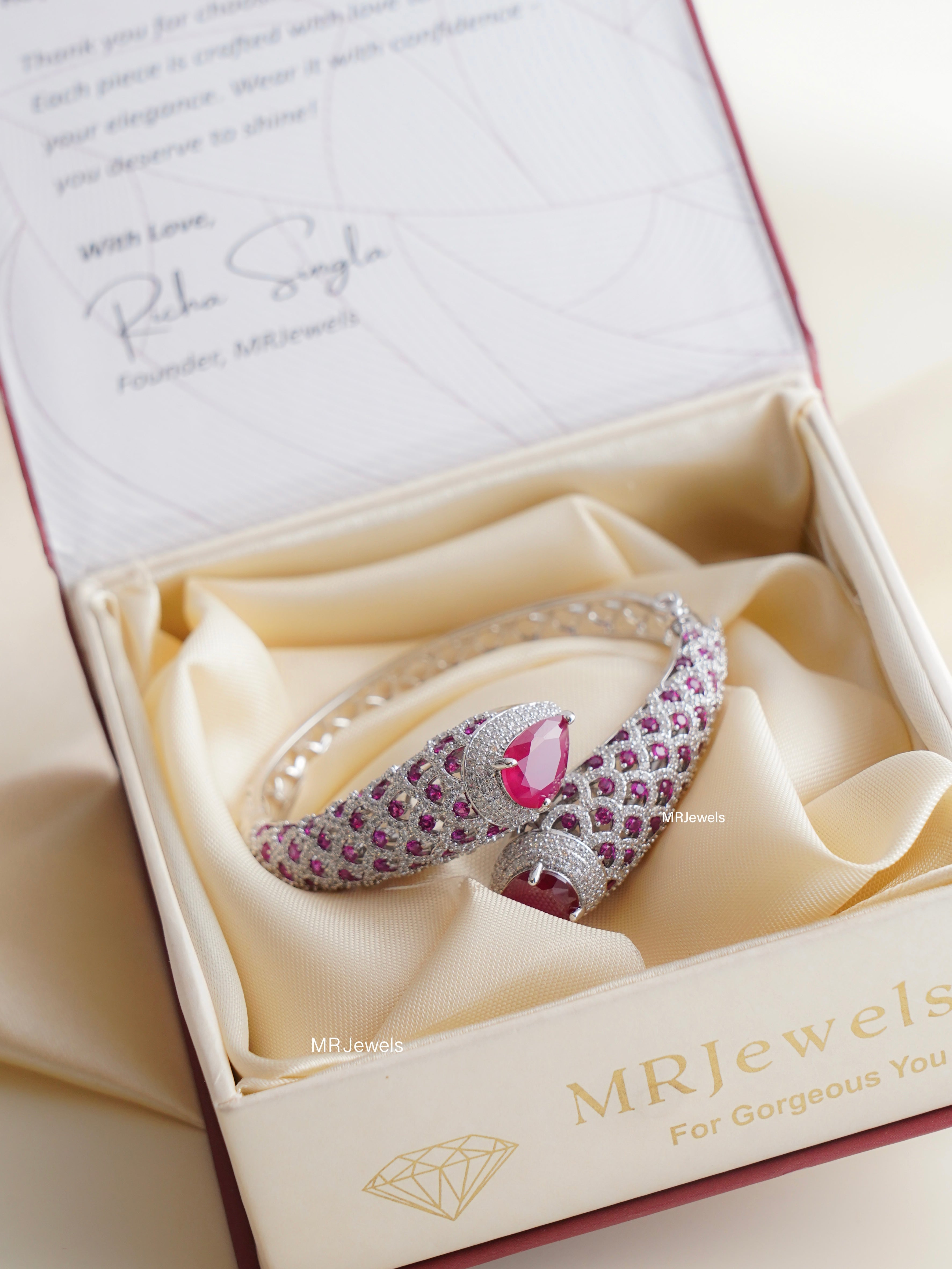 stack of regalia kada bracelets in ruby emerald amethyst and yellow pear stone variants