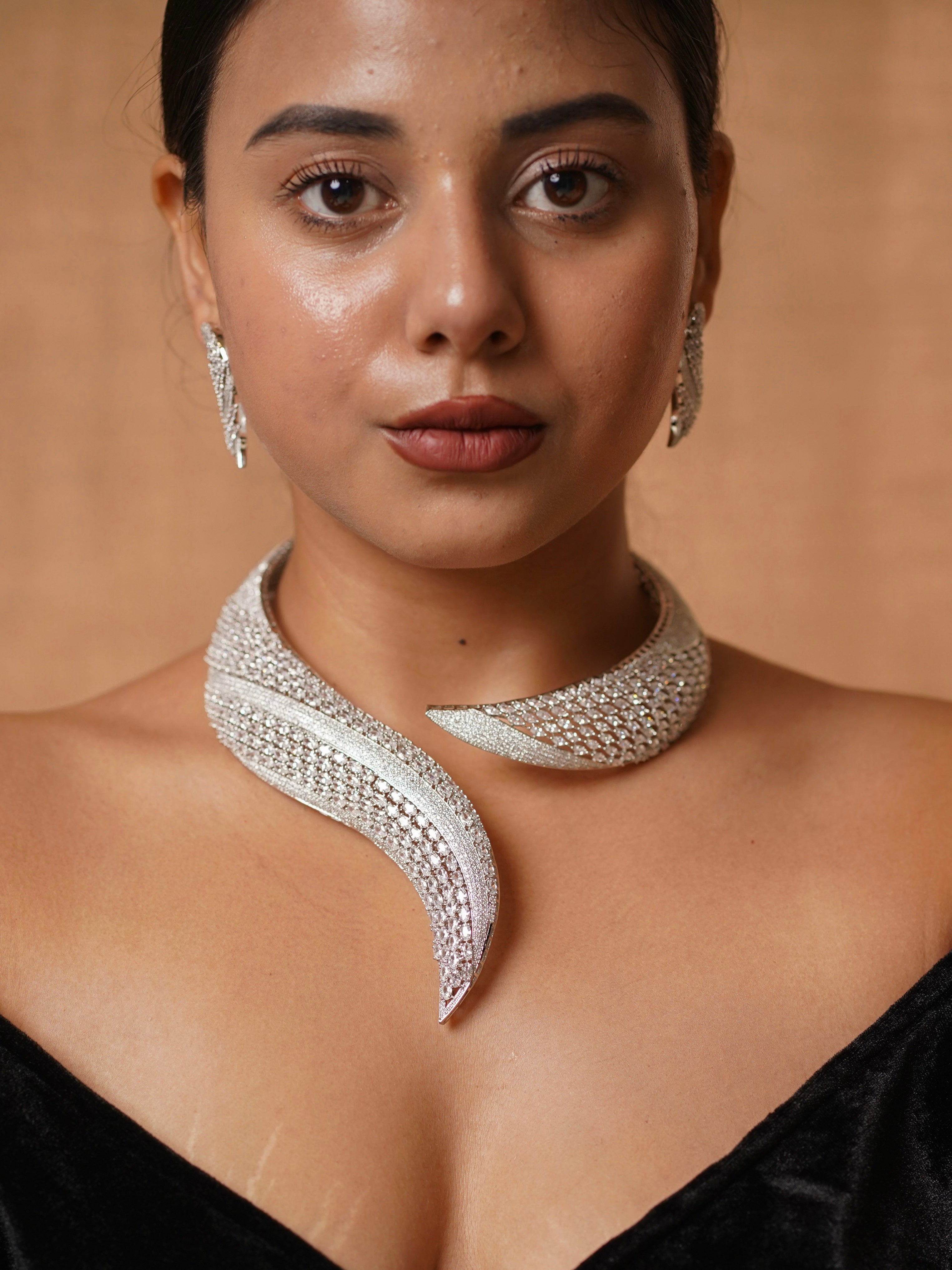 Front view of diamond collar necklace with cascading arrangement in a fluid modern design