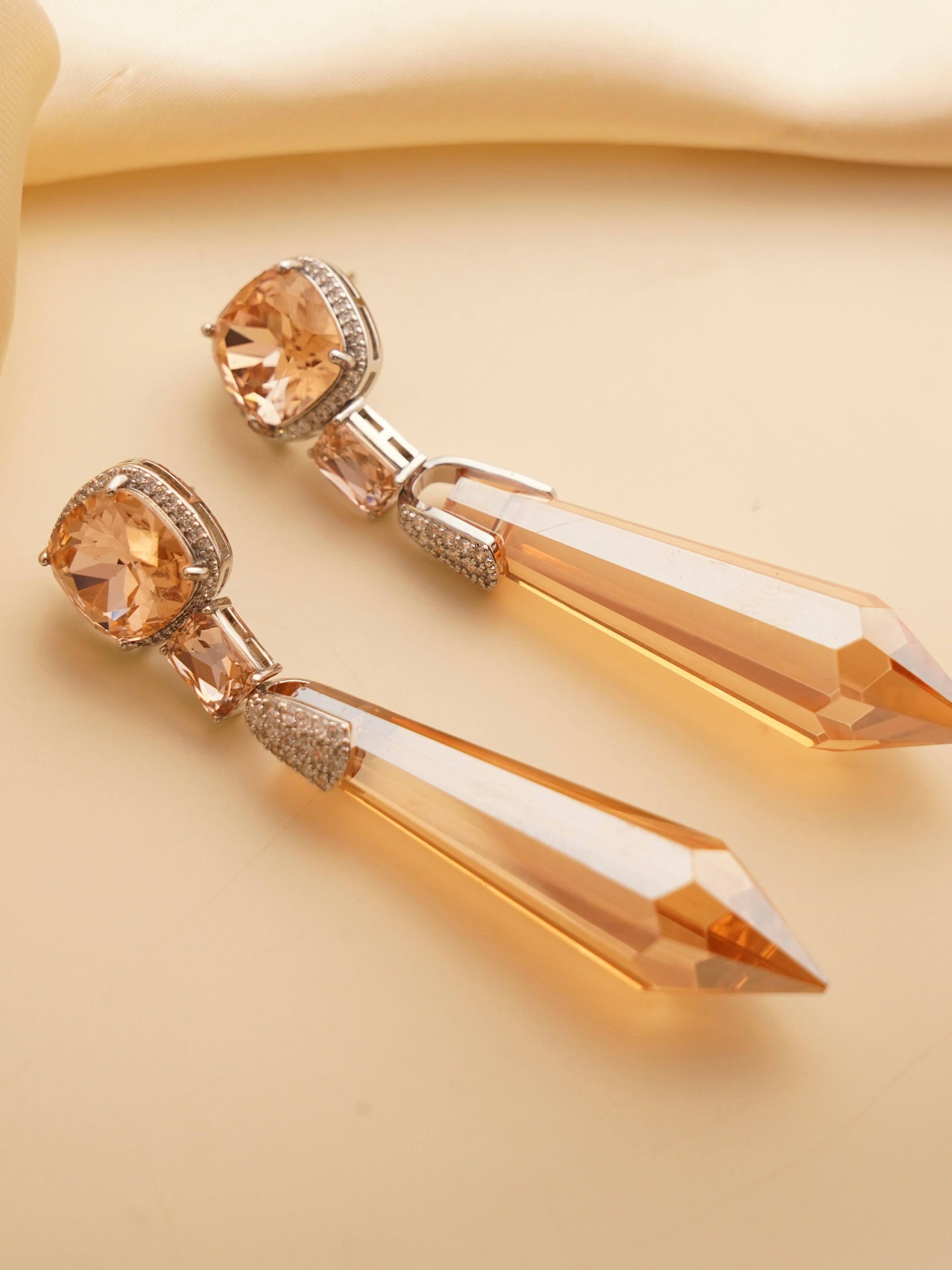 Back view of Celestial Prism earrings showcasing gradient crystal design and silver hooks