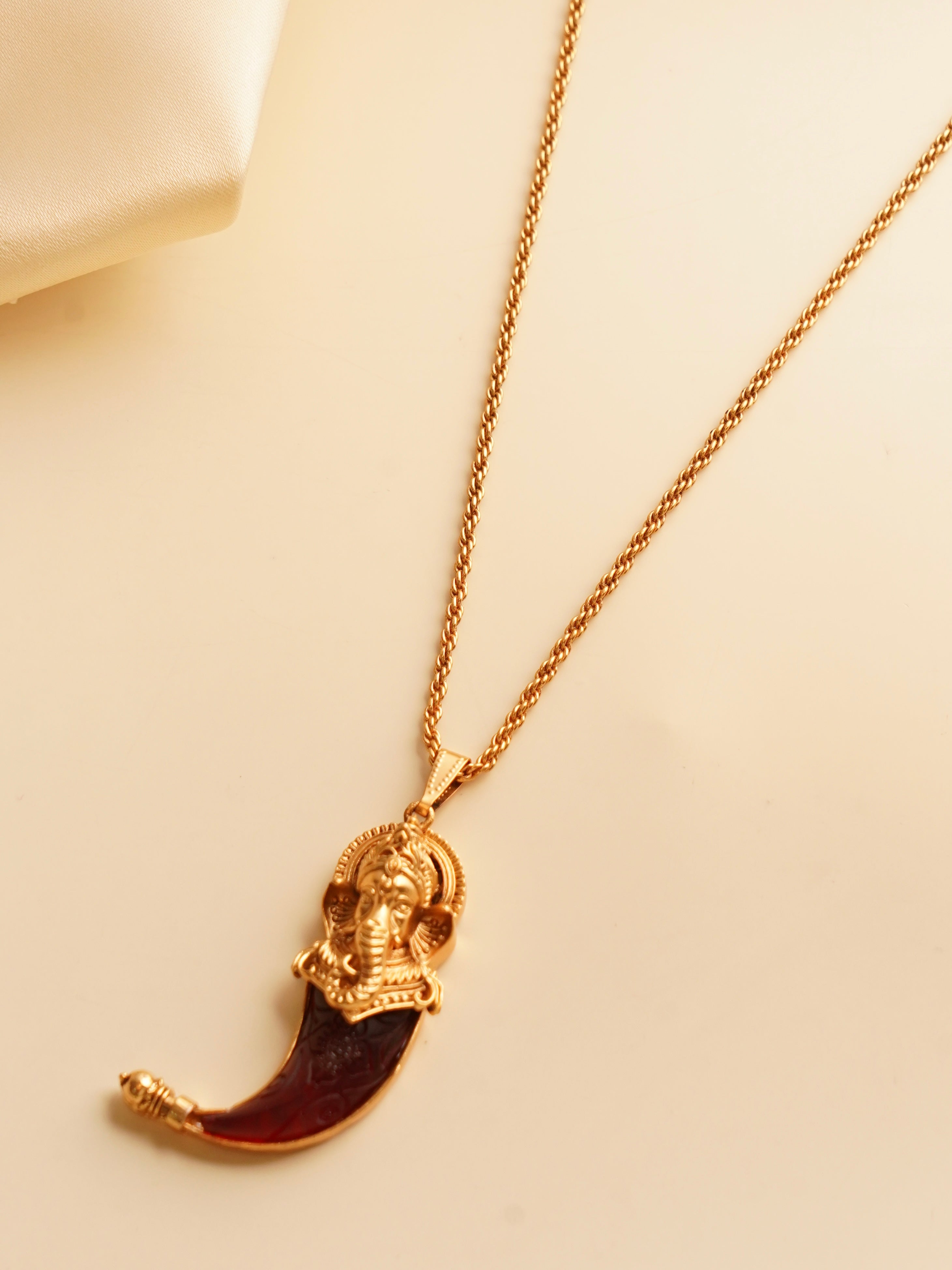 Side view of ganesha pendant necklace with textured chain design
