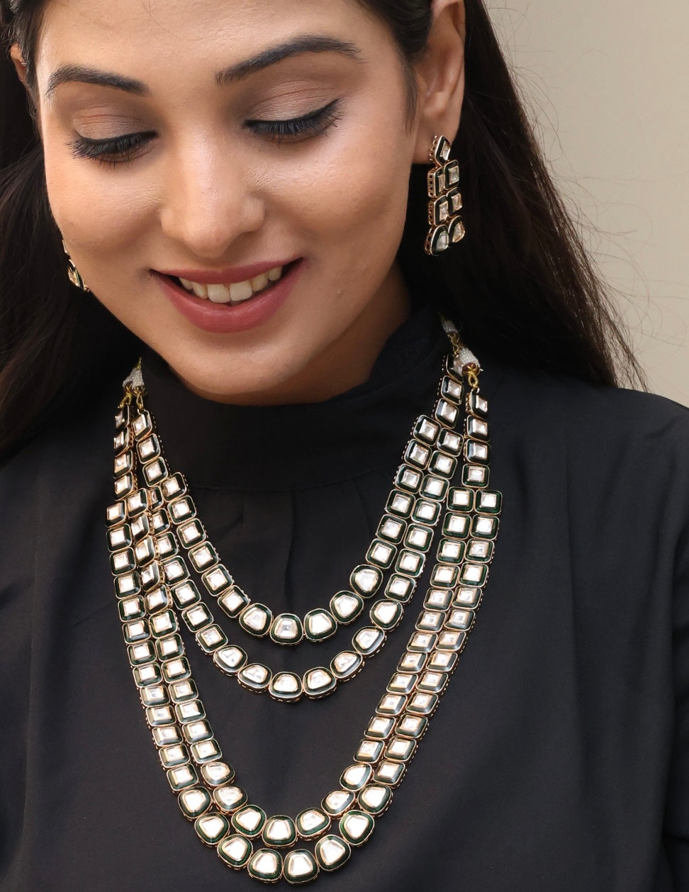 Overhead view of necklace set showing pendant, earrings, and coordinated polki design