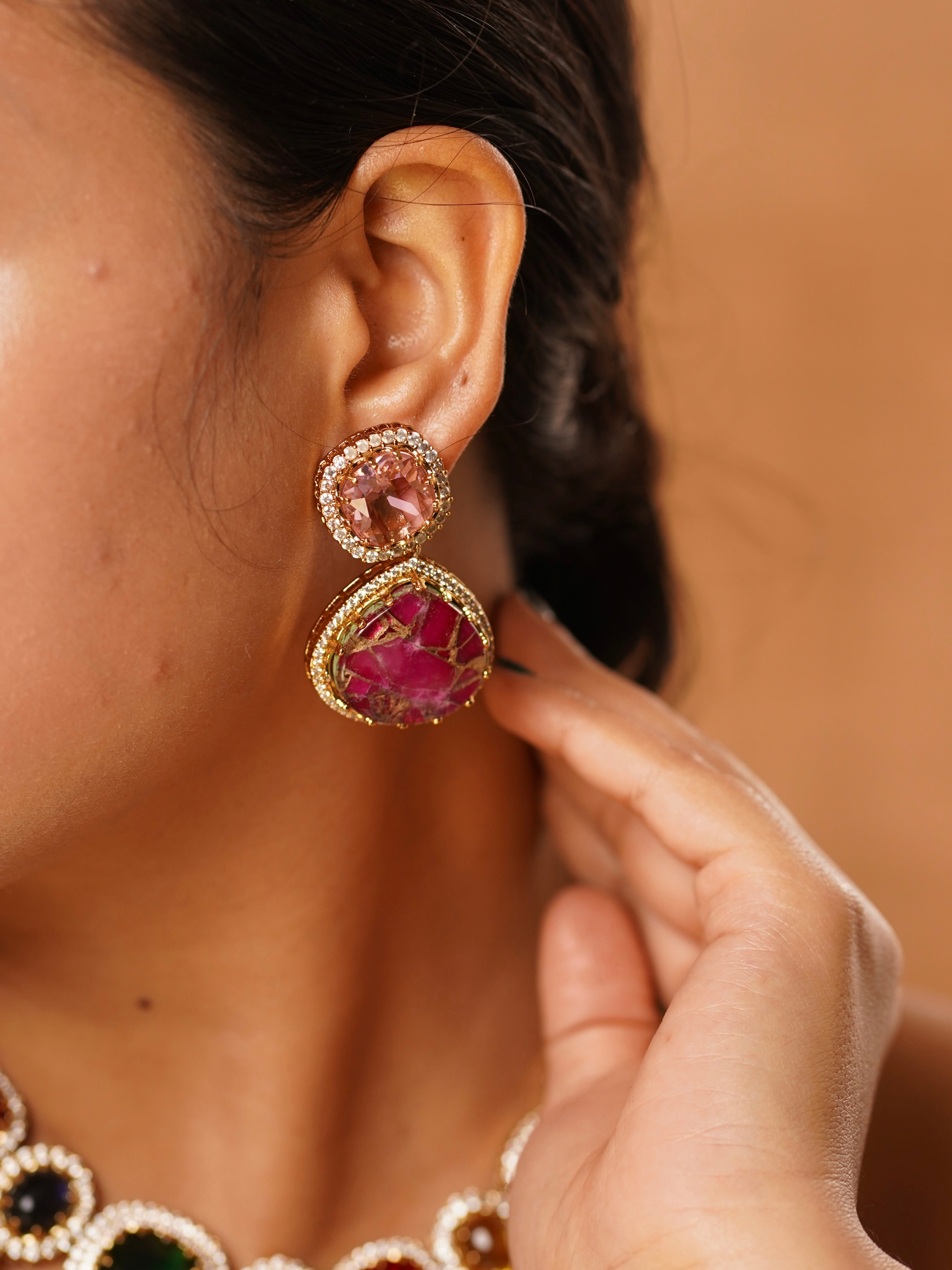 Navratna necklace set paired with oversized earrings and kada, showcasing vibrant hand-cut gemstones