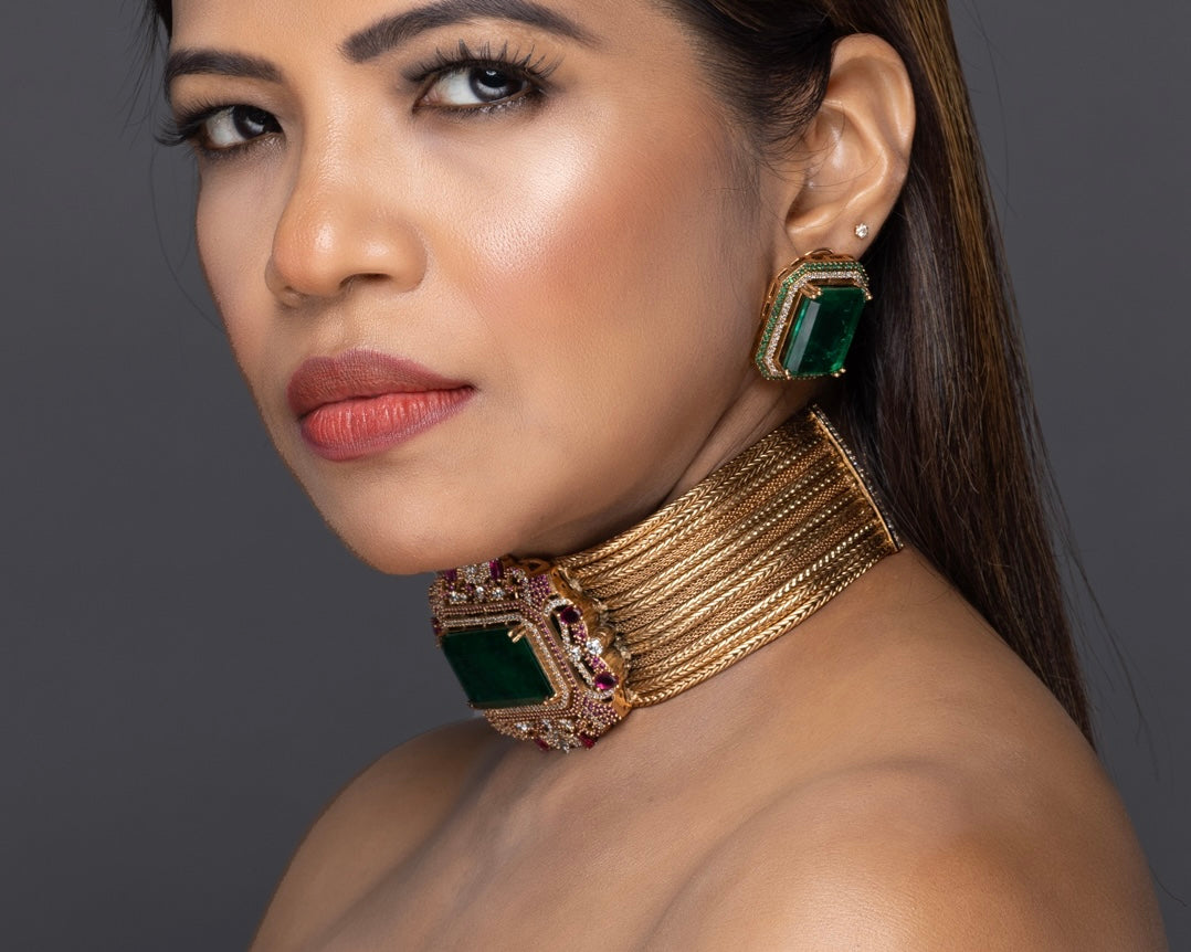 Close-up of emerald statement choker highlighting intricate gemstone arrangement