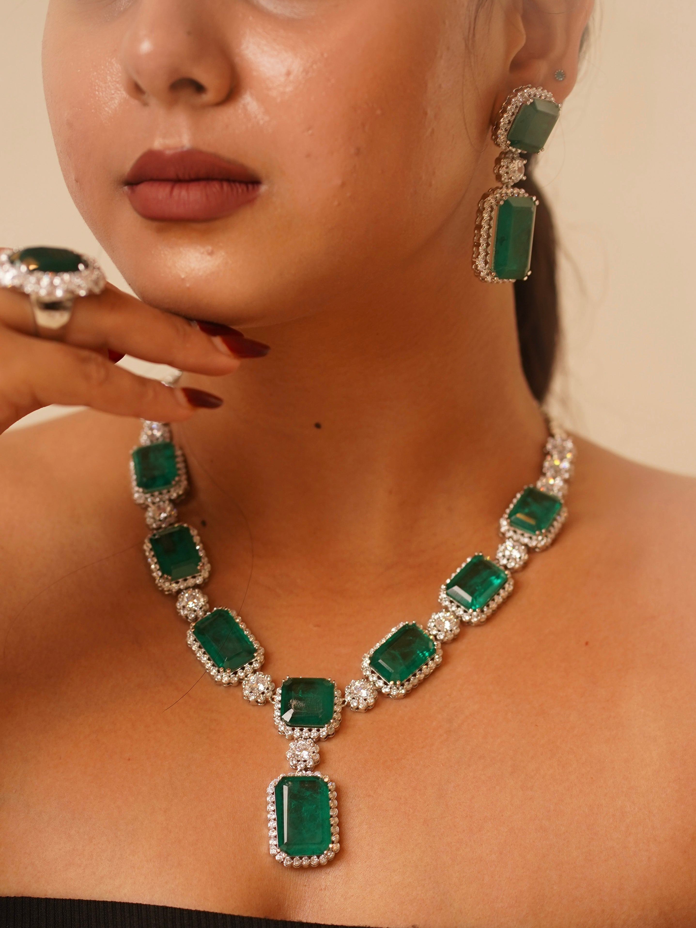Close-up of Emerald Dynasty set showing grand ring and CZ-detailed choker