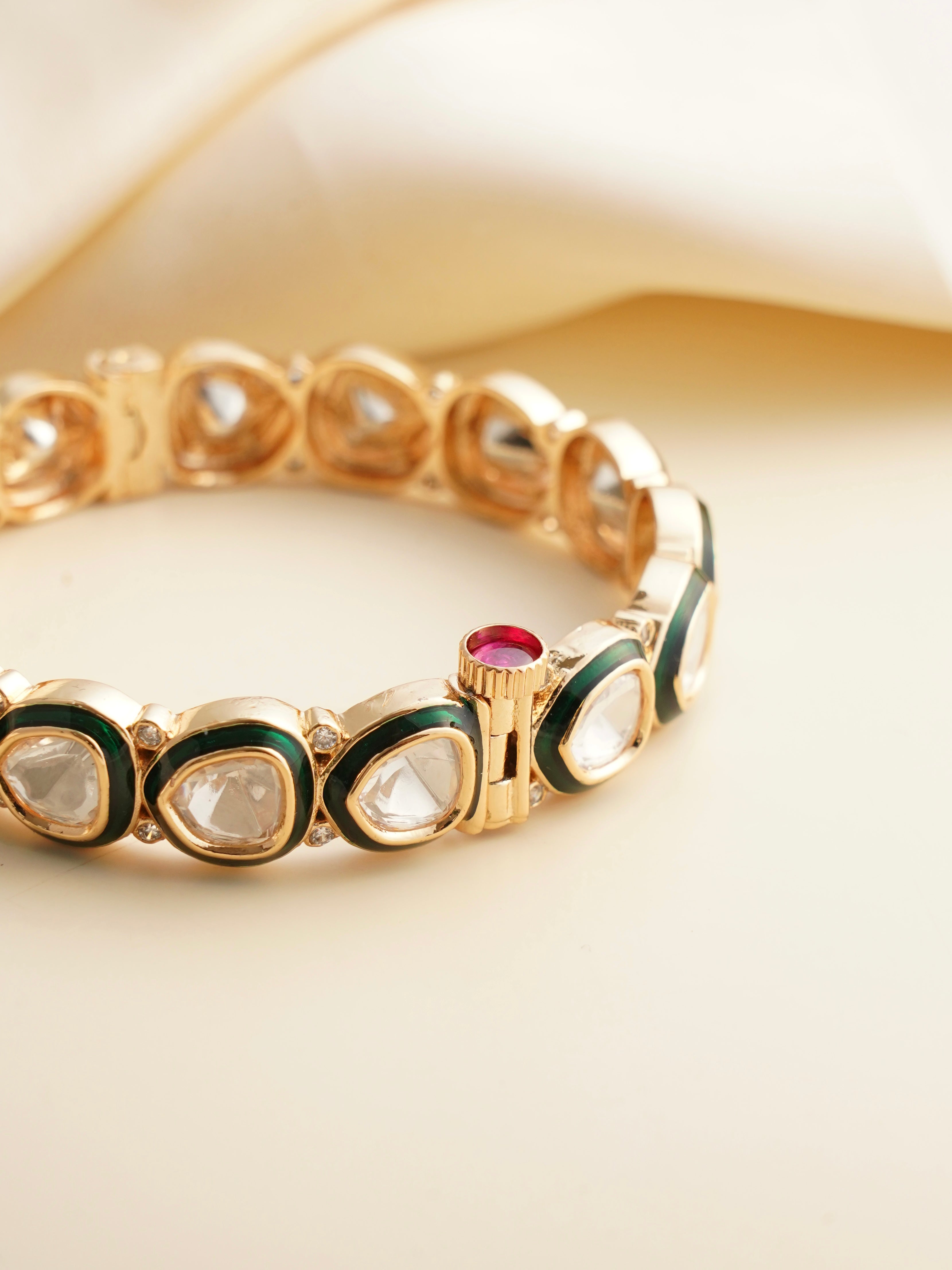 Close-up of bangle clasp showing ruby detailing and hand-set kundan stones