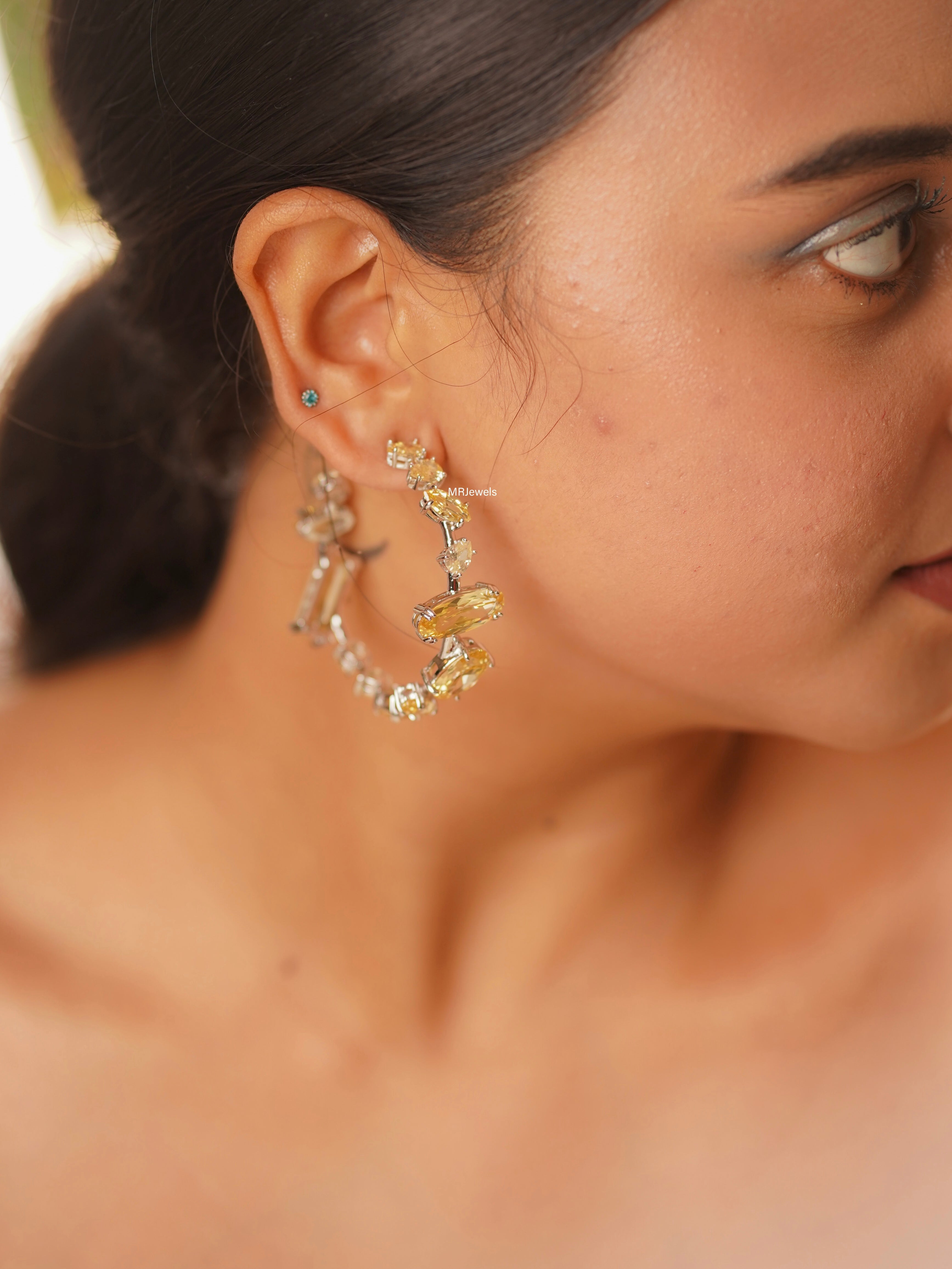 push‑back clasp detail of luxe swarovski crystal hoop earring highlighting secure fit