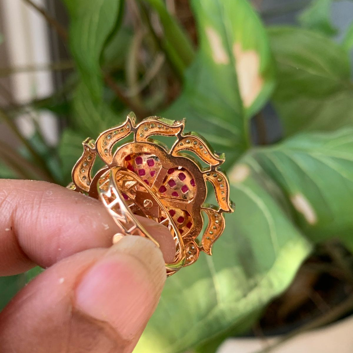 Gold-plated designer ring with ruby flower motif and adjustable free-size design