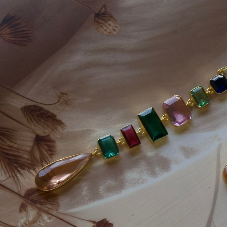 Close-up of twilight-inspired necklace featuring shimmering gemstones and gold detailing