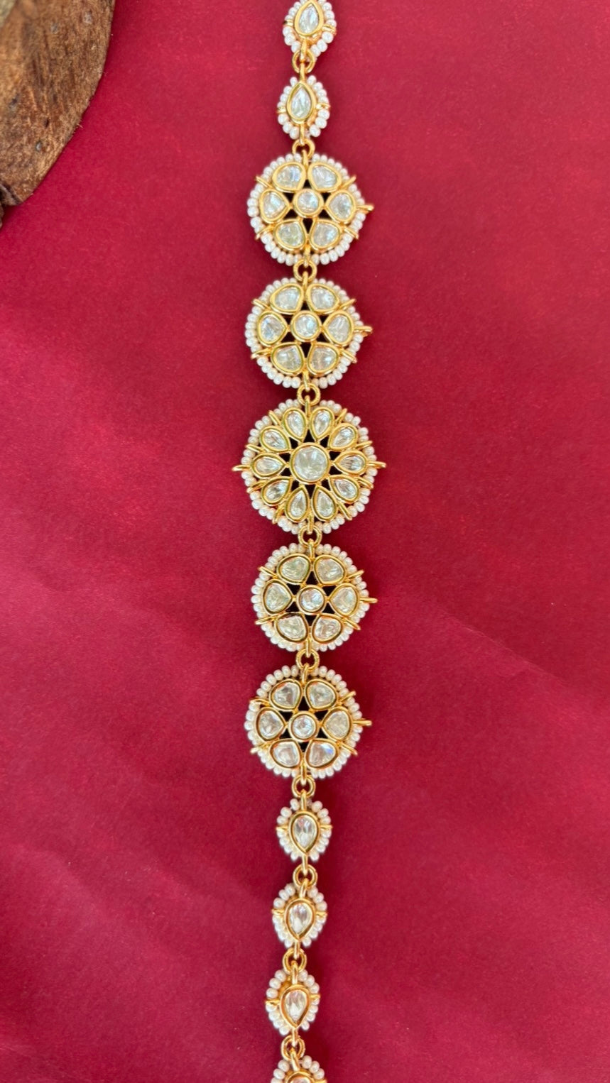 Side profile of kundan sheeshphool featuring floral arrangement and bead details