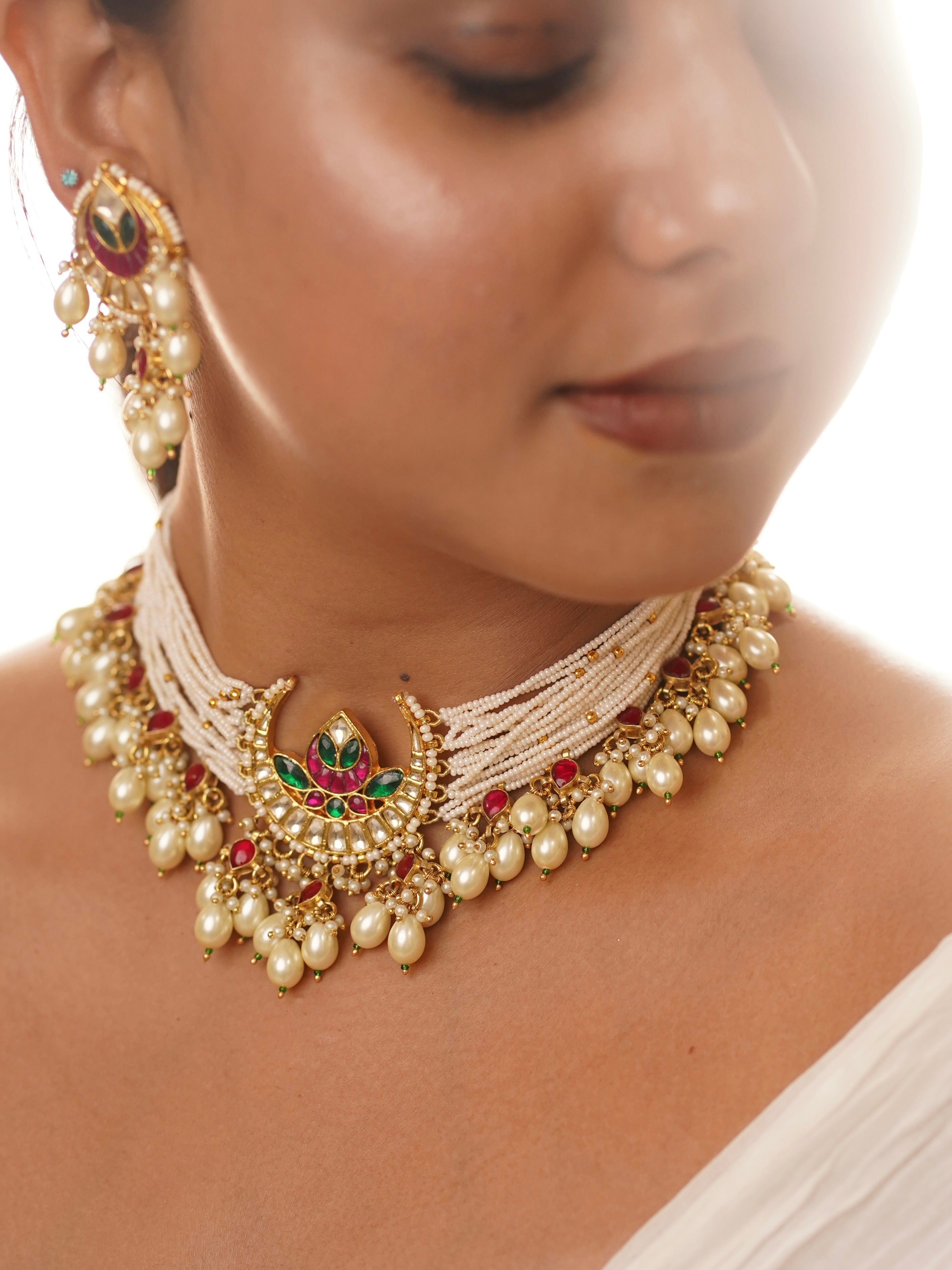 Meenakari pearl choker set with lotus-inspired pendant and cascading kundan-pearl drop details