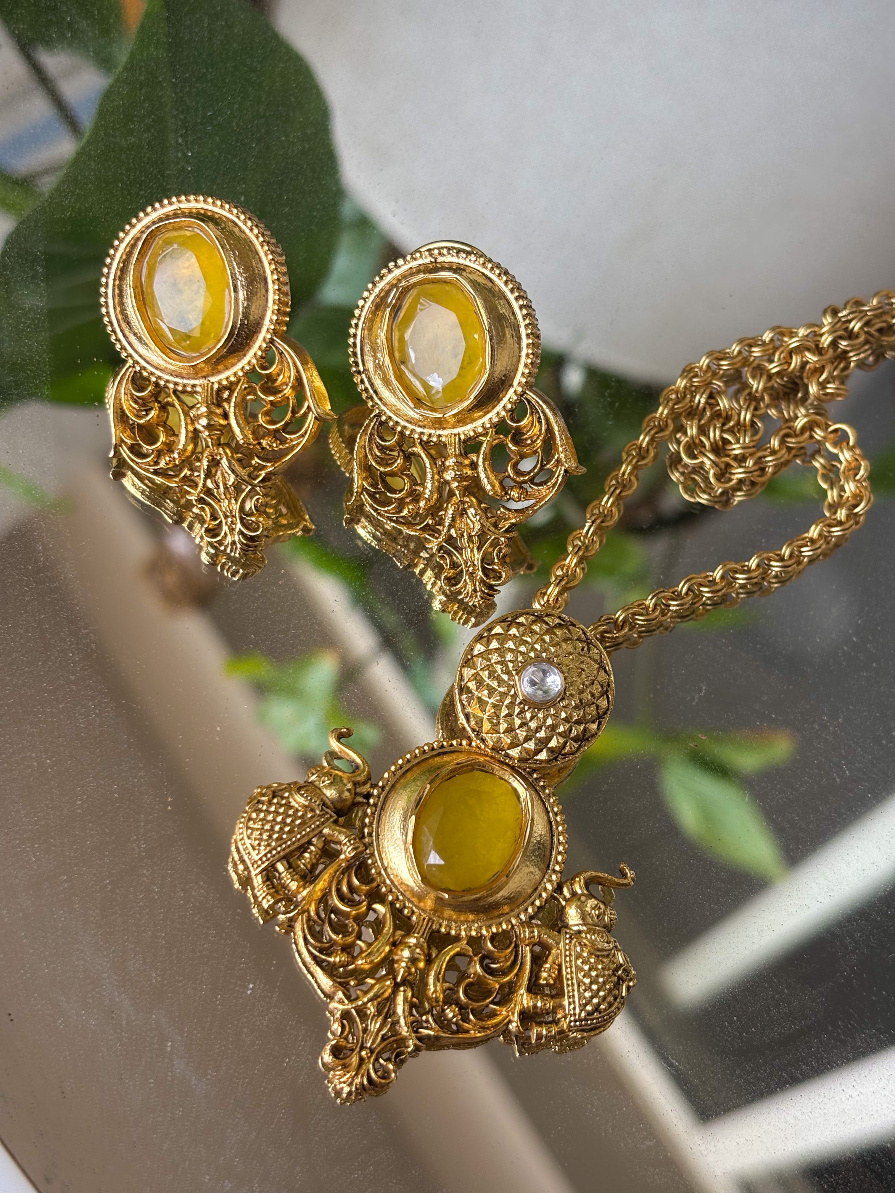 Full set view of amrapali-inspired necklace and earrings with gemstone accents and gold polish