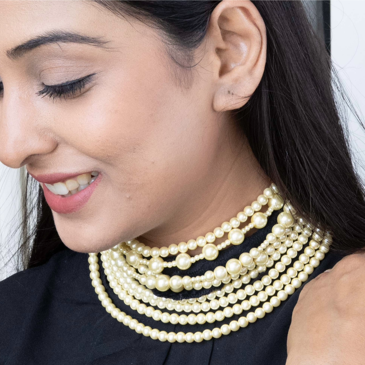 Multilayered pearl necklace with closely strung white pearls in front view