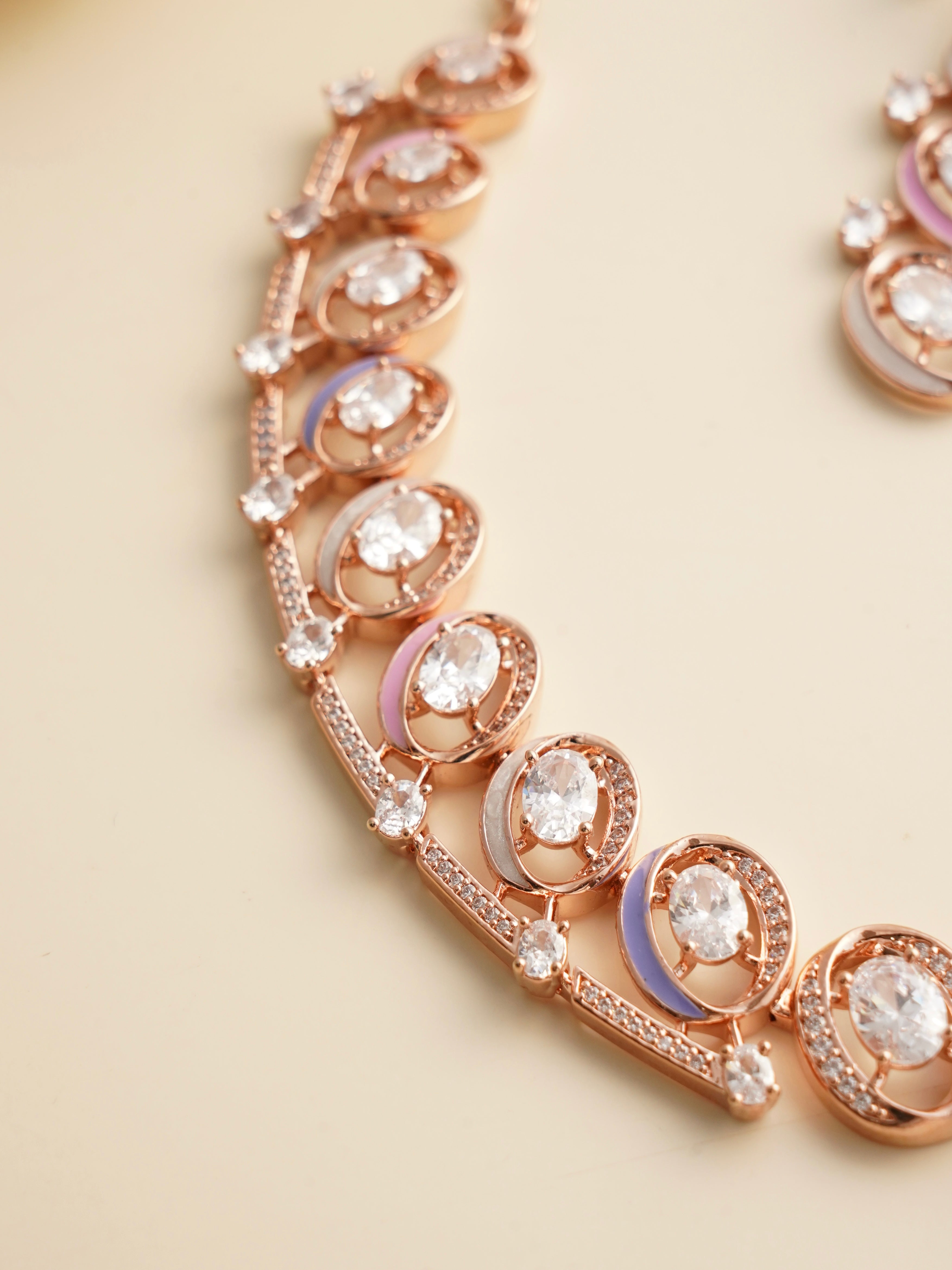 Angled view of meenakari enamel necklace in rose gold finish