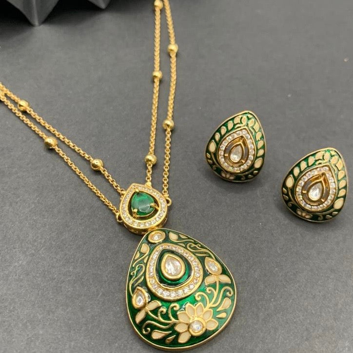 Side view of gold-plated meenakari pendant set with kundan stones and floral patterns