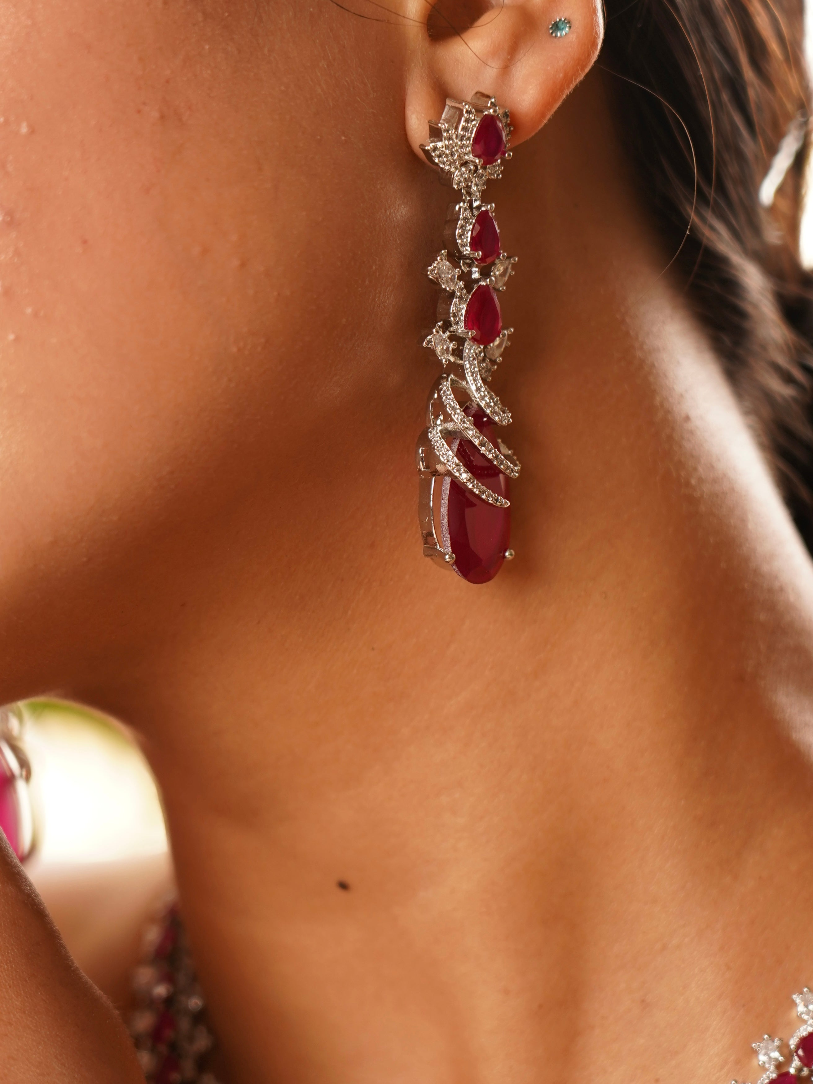 Detailed view of ruby necklace clasp and diamond-studded side links