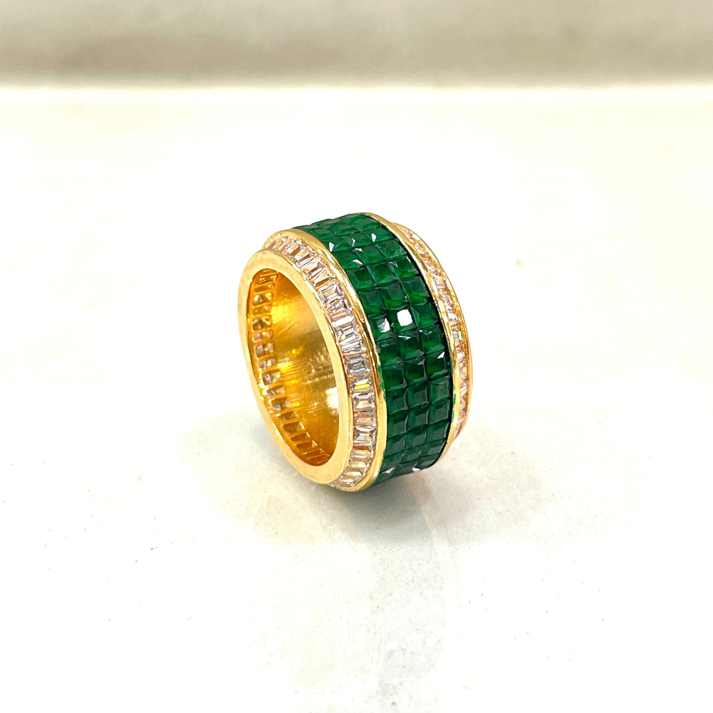 Emerald and diamond gold band with baguette-cut halo and pave-set green stones
