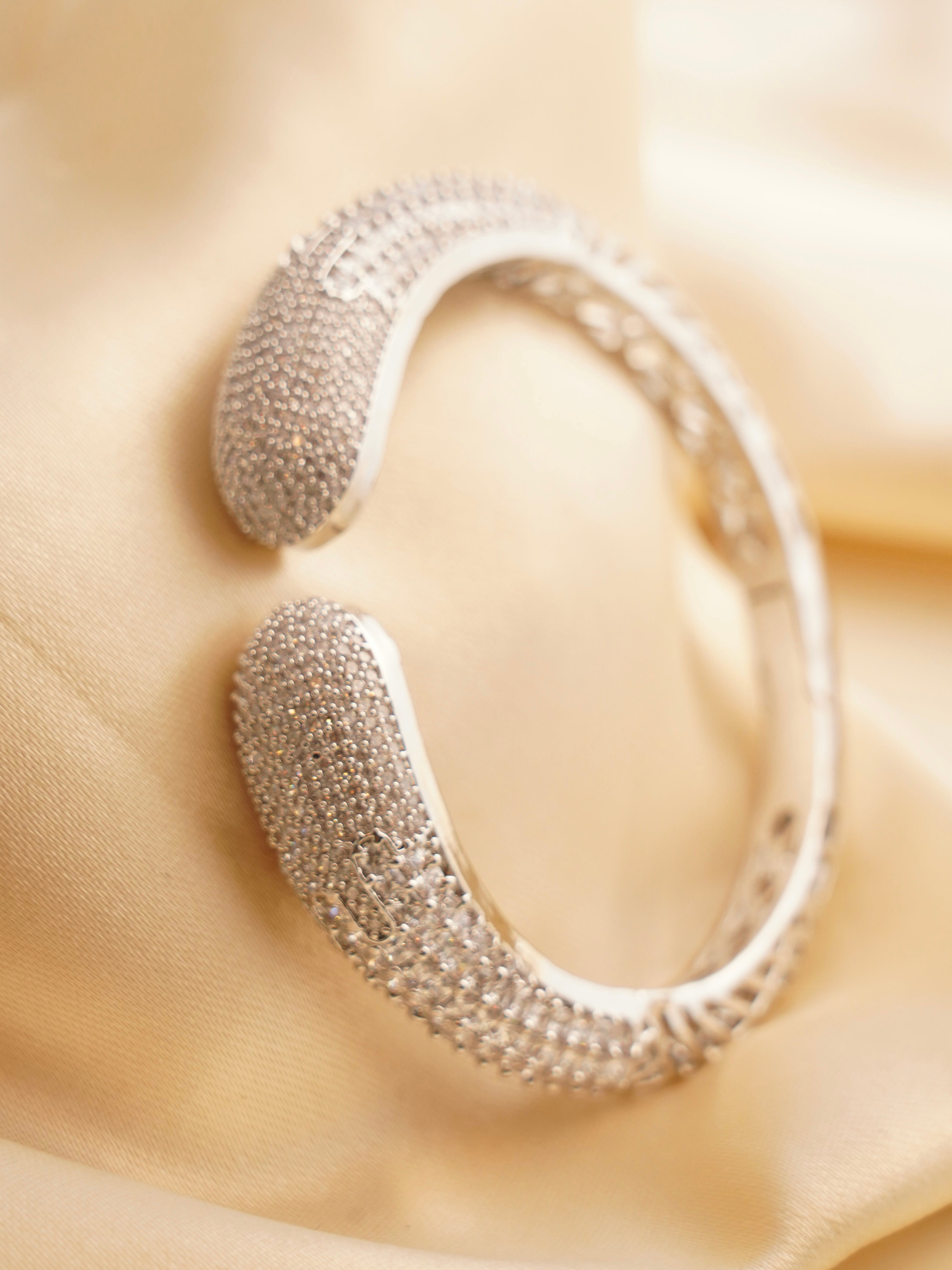 Rear view showing clasp and finish of gold-toned diamond-style bracelet