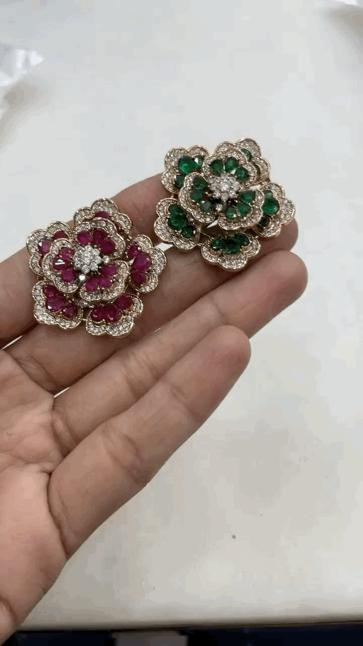 Rotating dual-layer floral ring with intricate gold-toned detailing, shown in motion