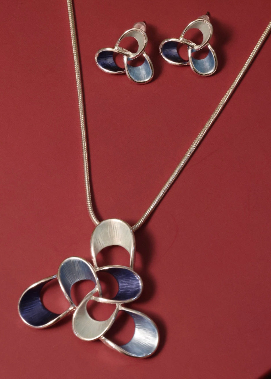 Pendant and earring set with polished copper alloy and modern minimal design