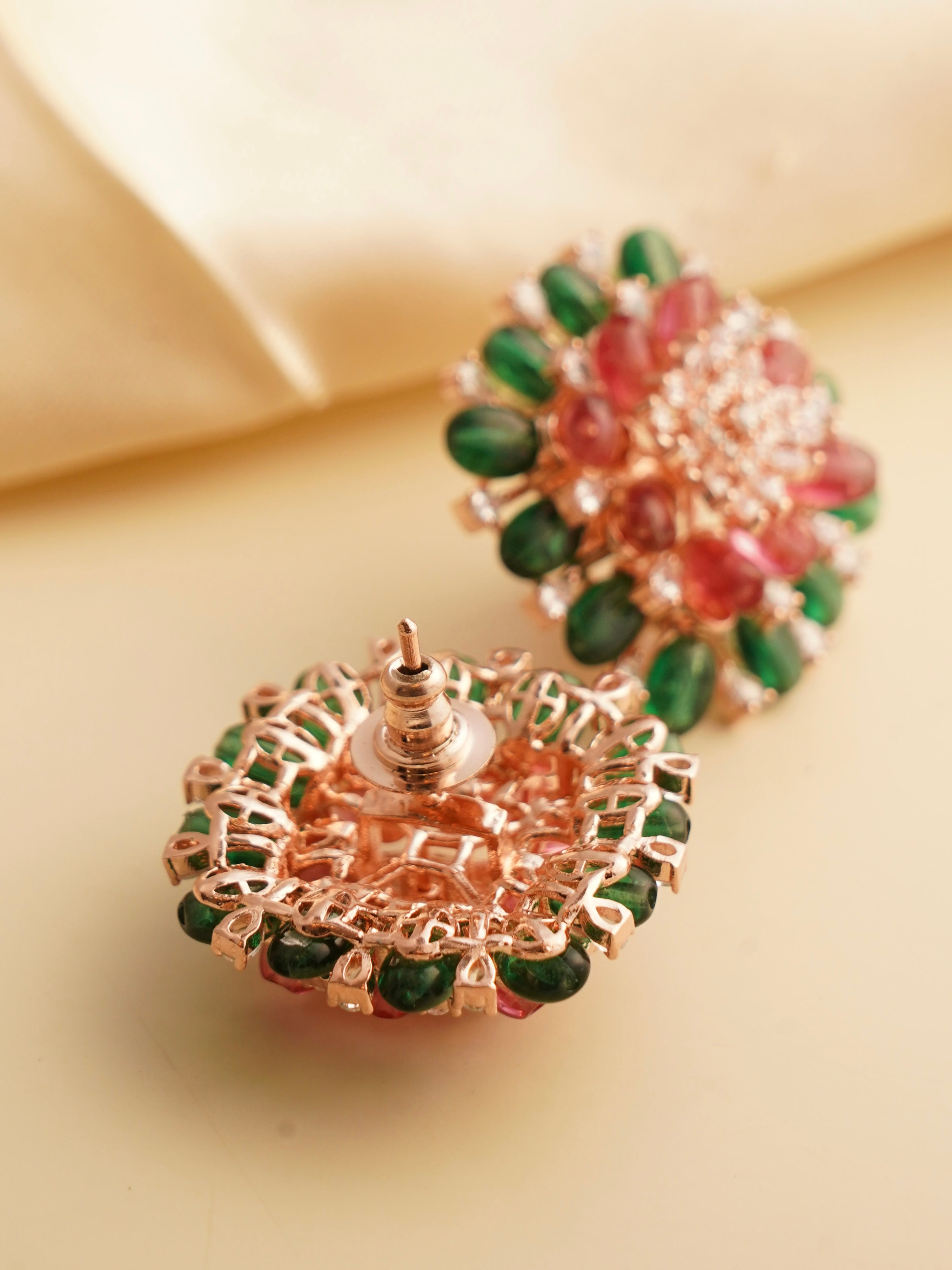 close-up of colourful diamond-style beaded stud earrings in premium finish