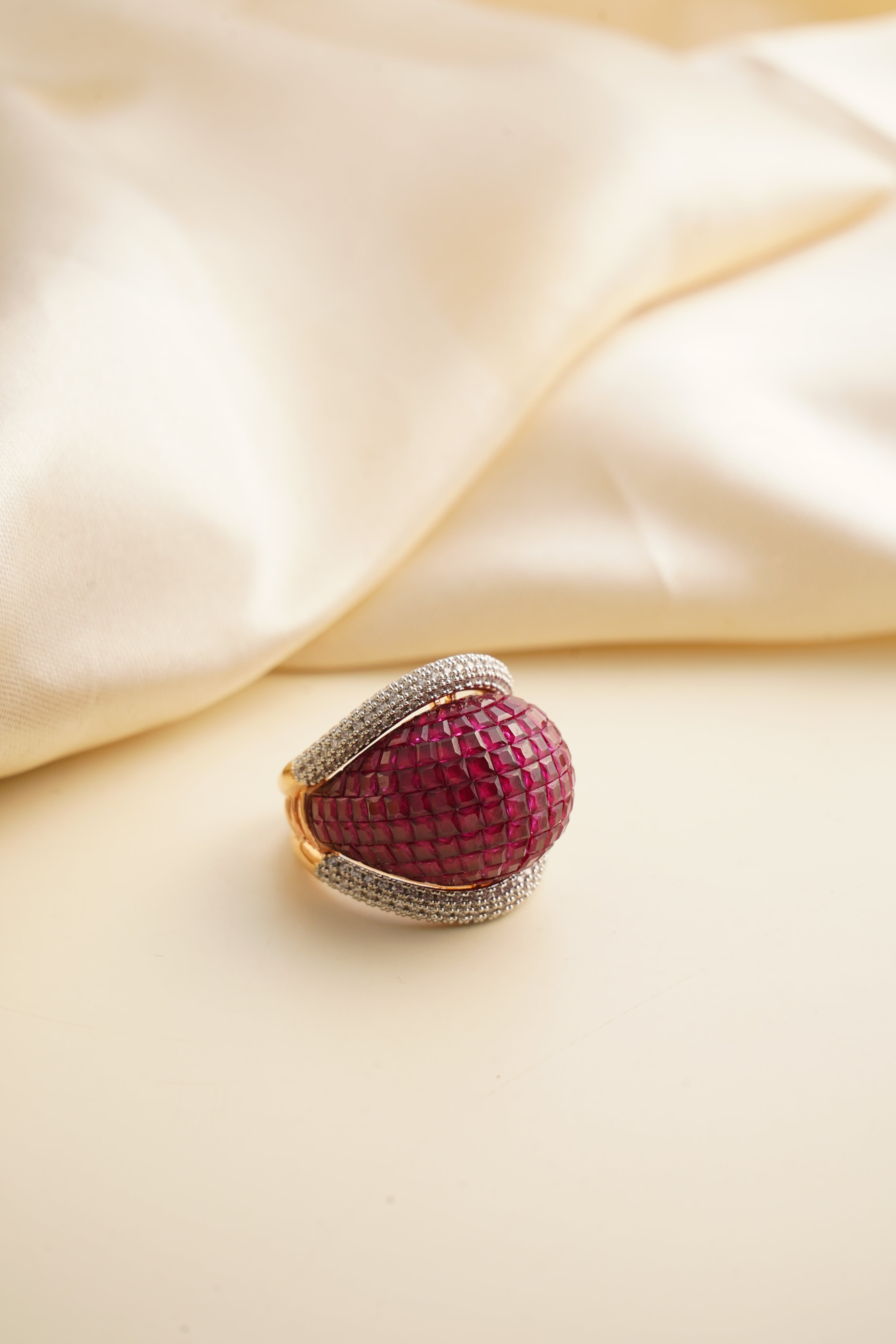Premium ruby zircon ring with halo of shimmering stones in gold-plated finish