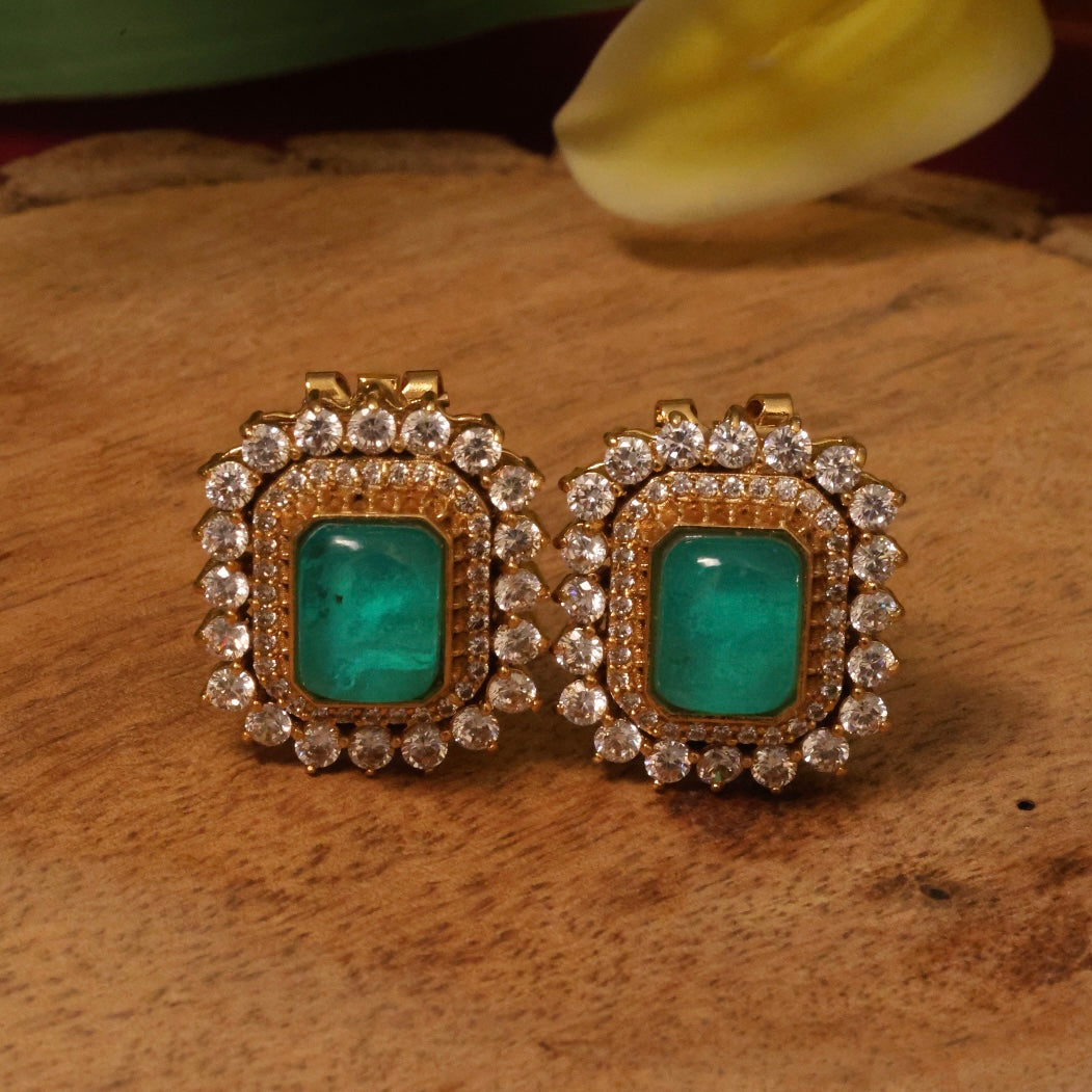 Back view of gold-plated emerald square earrings with clear crystal surround