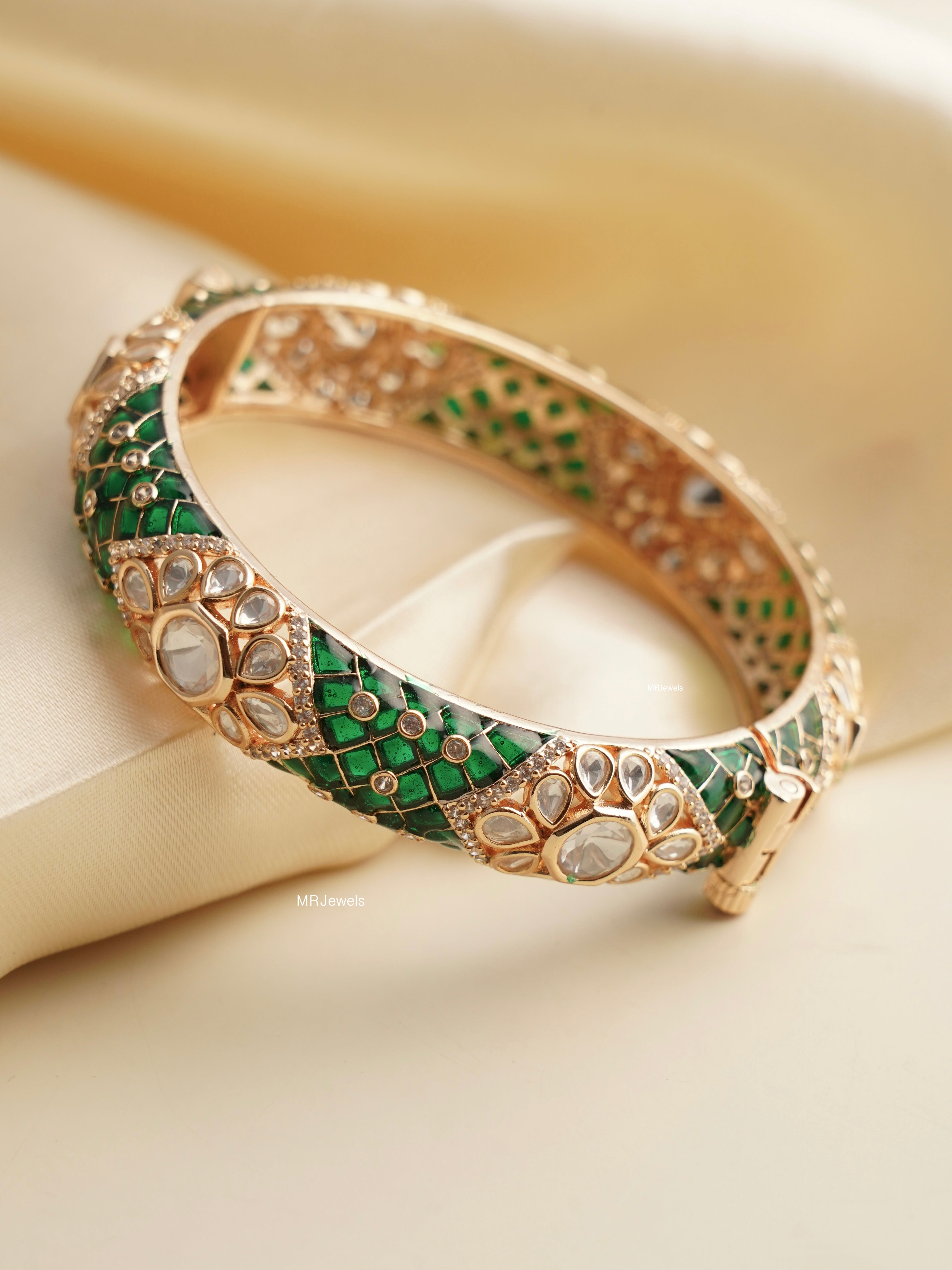 Inner view of enamelled openable bangles with kundan and polki embellishments