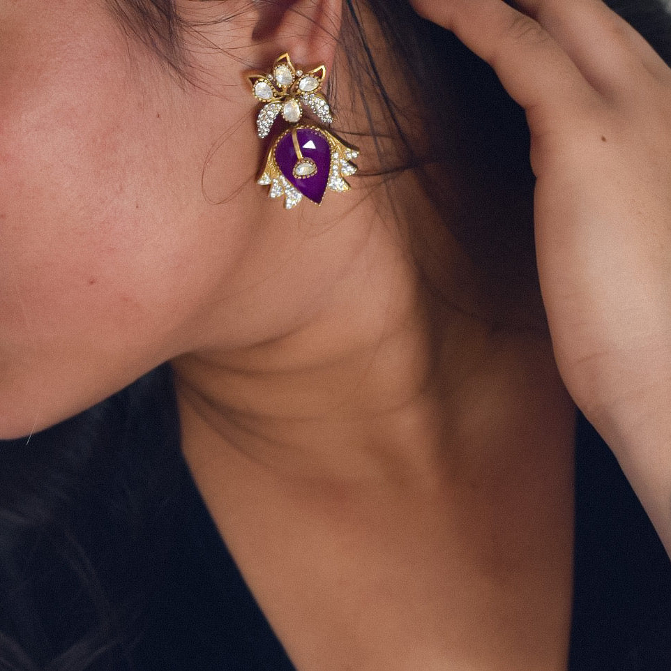 front view of bold green doublet stone earrings with gold and sparkling crystal detailing