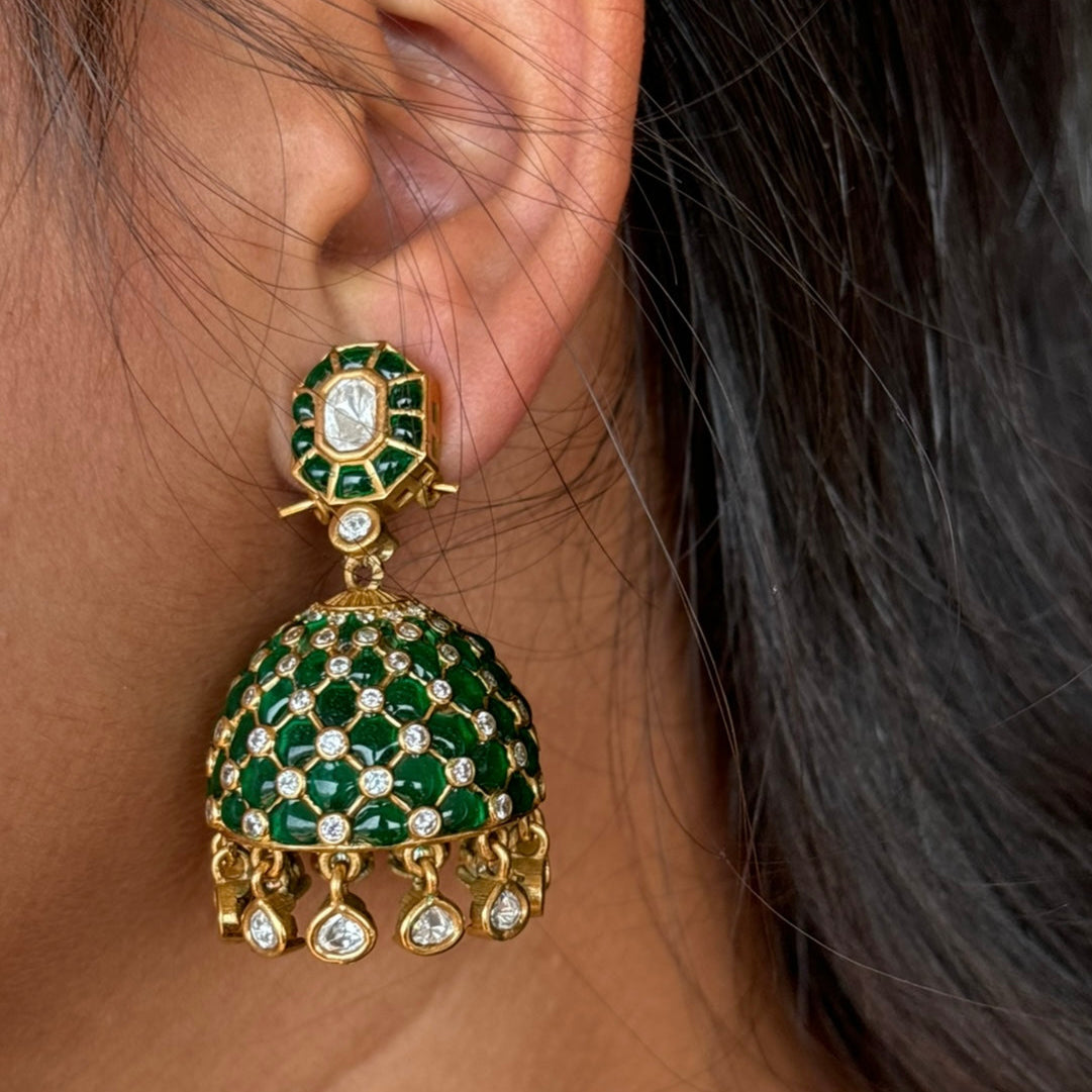 Earring back detail of tara polki jhumkas with dangling golden bells