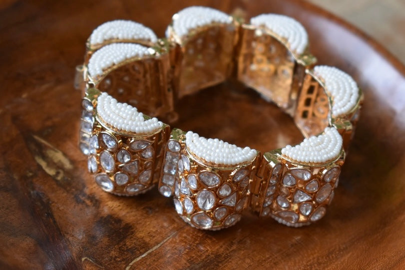 Gold-plated moissanite bracelet with floral gazra-inspired design and pearl accents