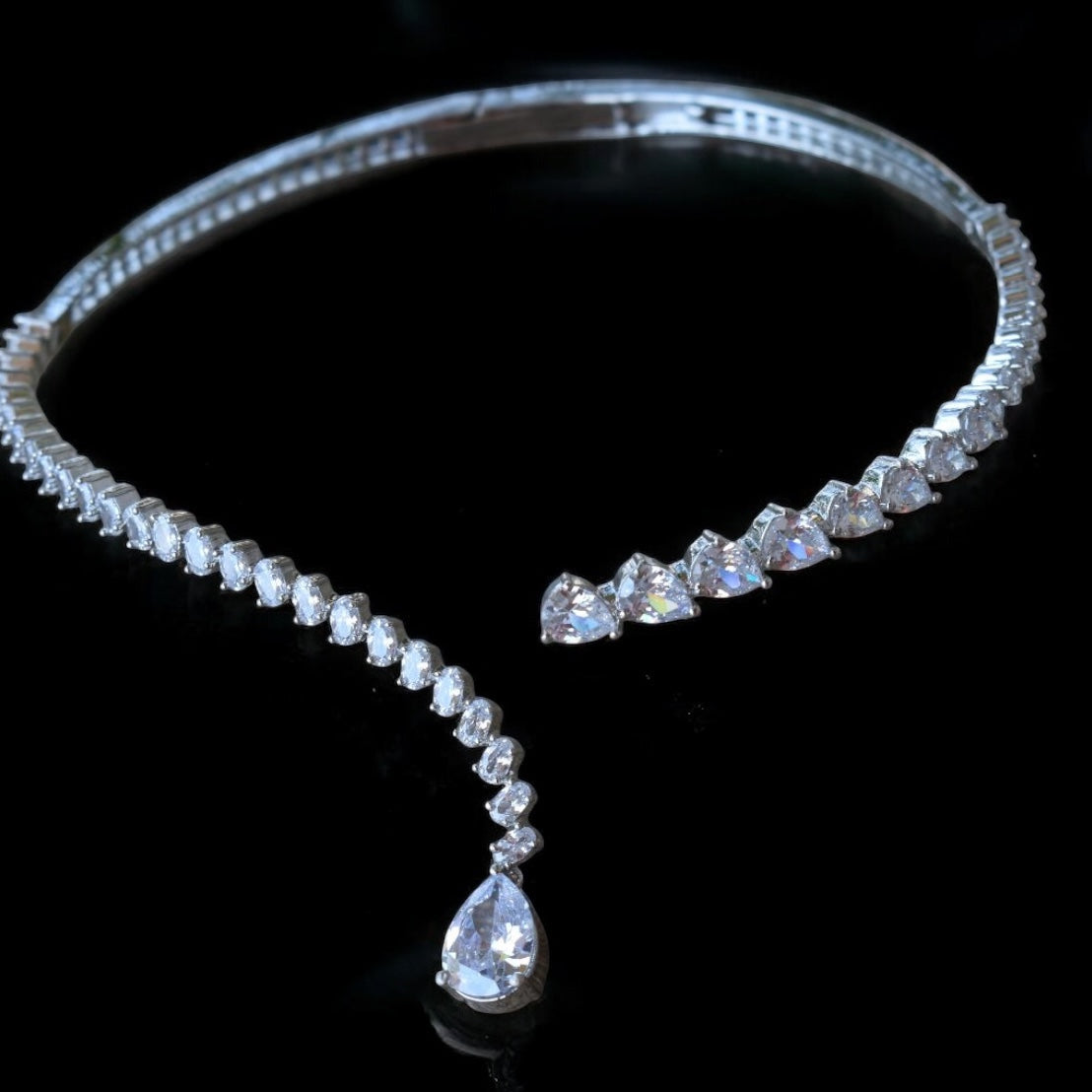 Side view of celeste teardrop diamond necklace set with graceful curve and sparkle