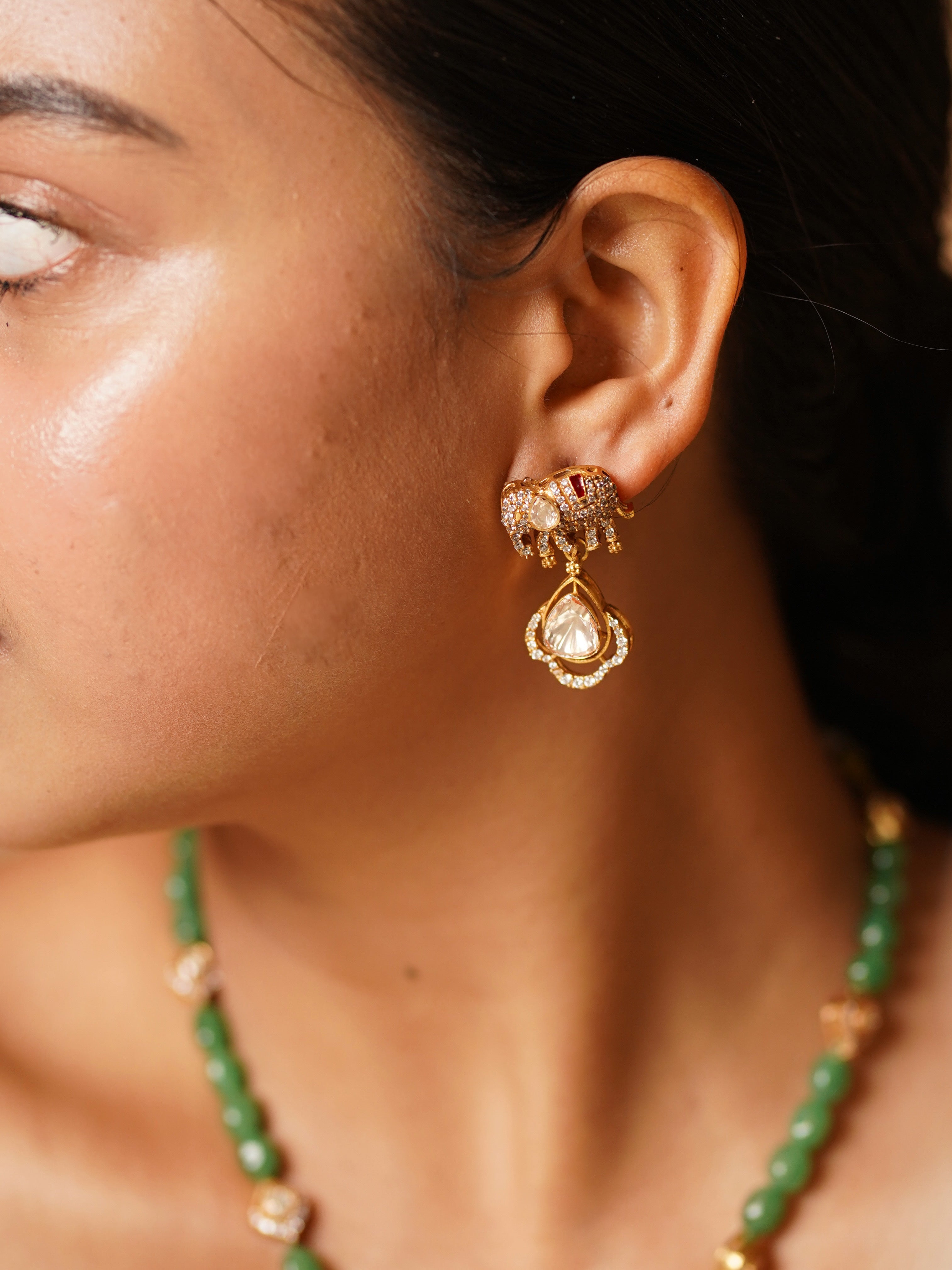 Close-up of enamelled elephant pendant with kundan and green highlights