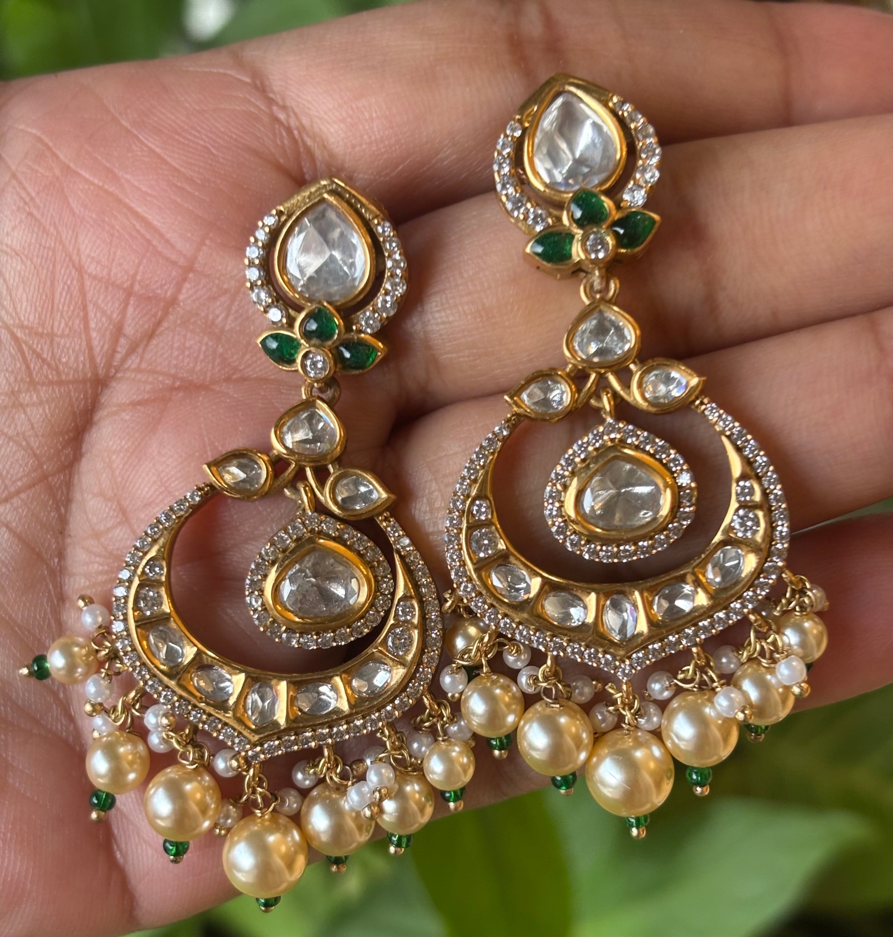 Front view of handcrafted chandbali earrings with uncut-style kundan and pearl embellishments