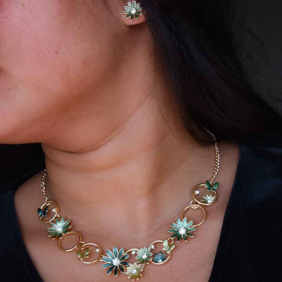 floral enamel necklace with butterfly motifs in pastel shades, spring-inspired design