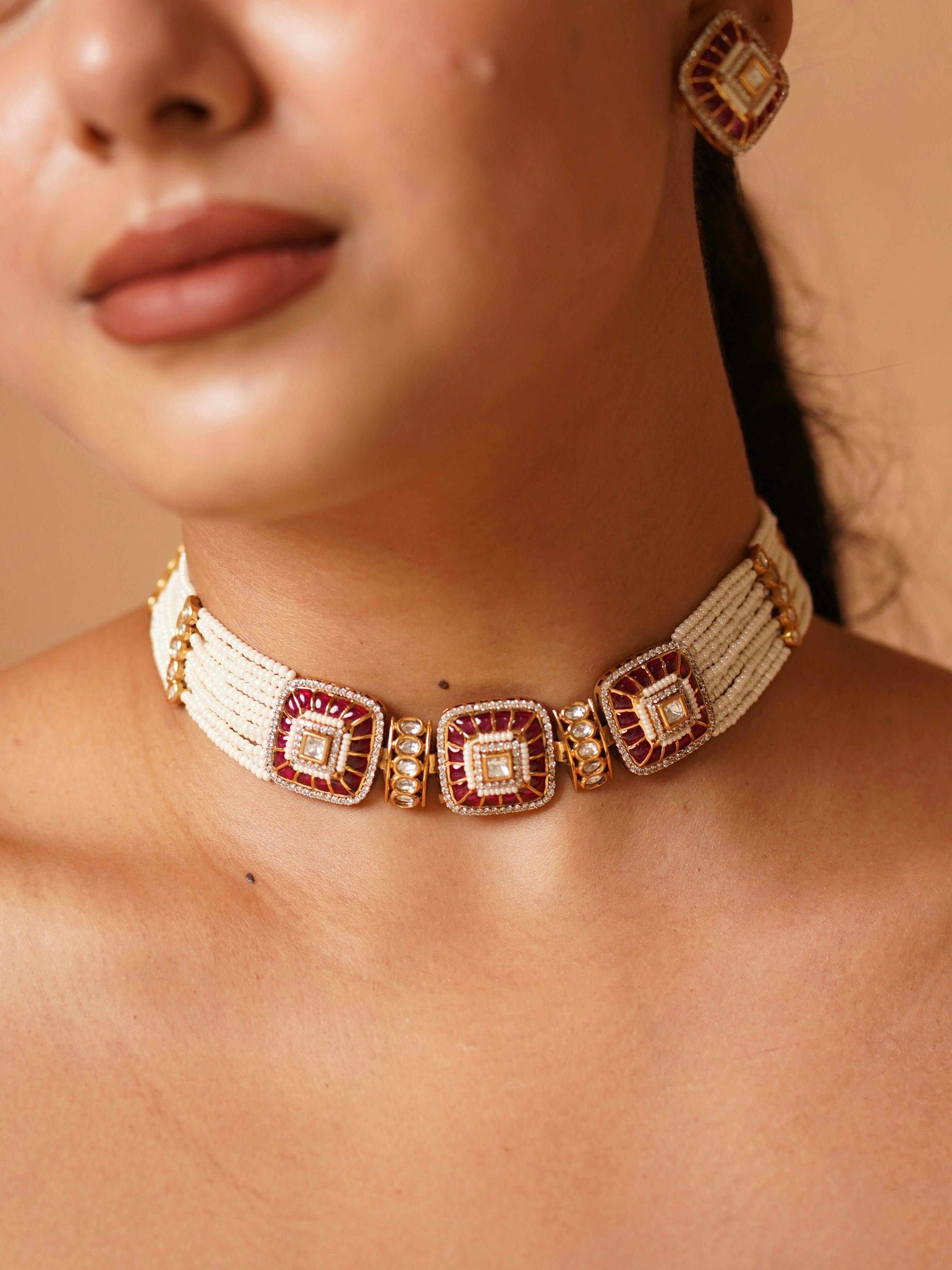 Polki and pearl choker with meena khaka enamel work on a gold base and diamond accents