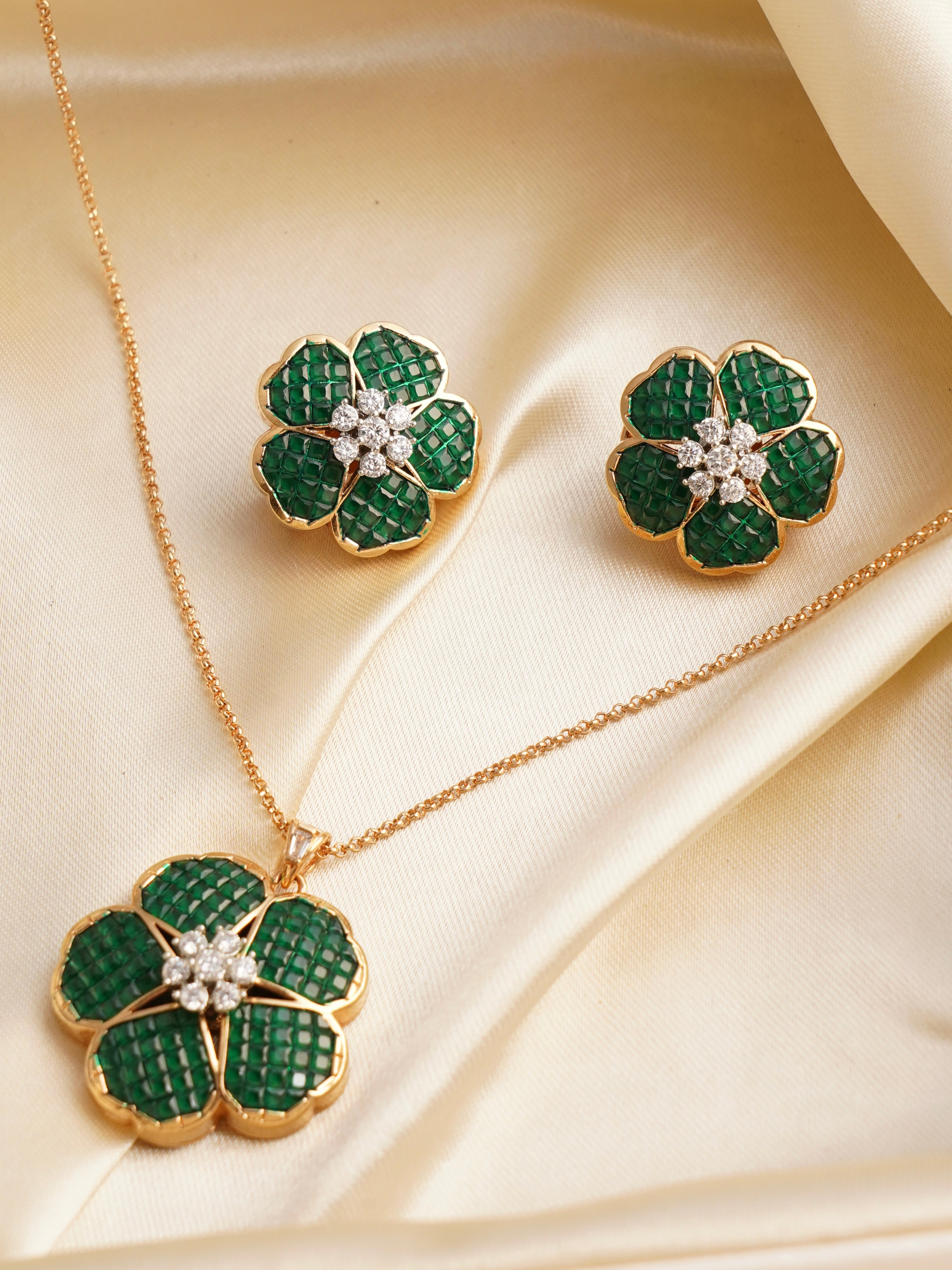 Side angle of pendant necklace featuring enamel petals and zirconia centre