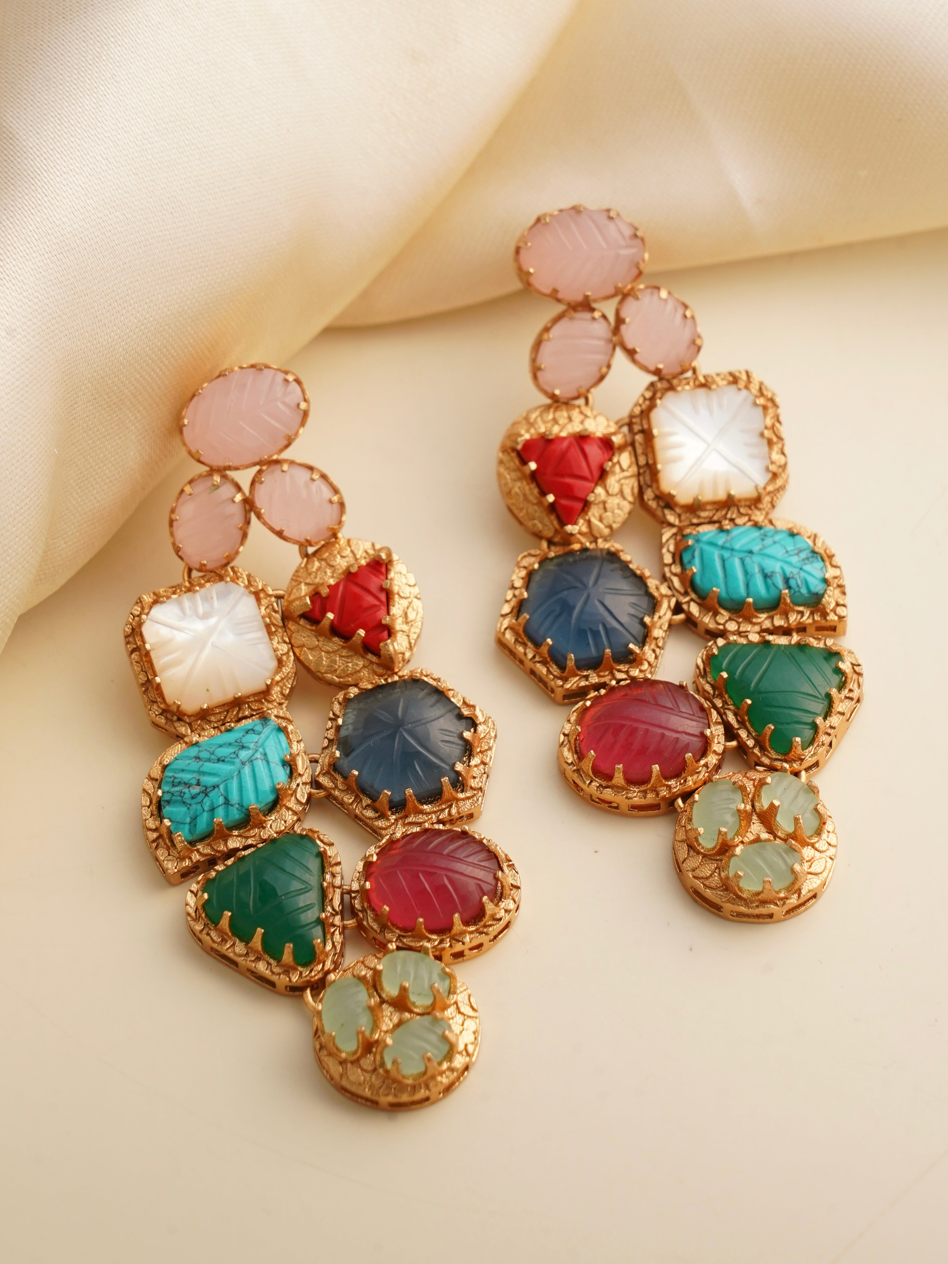 navrattan gemstone cluster earrings with multicolored carved stones framed in gold