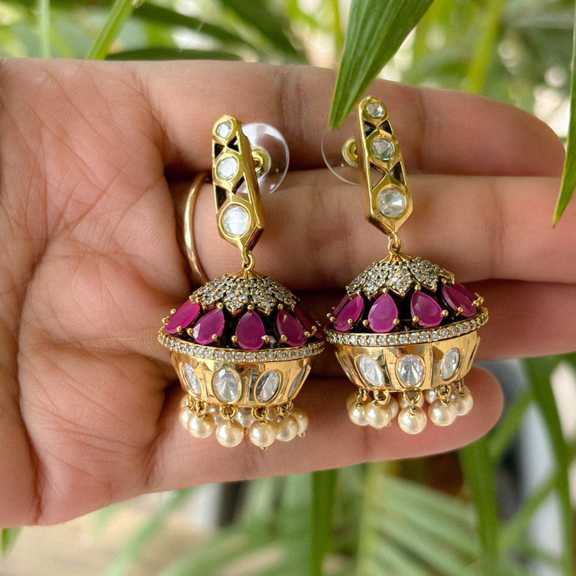 Ruby kundan jhumka earrings with Victorian polish and intricate traditional detailing