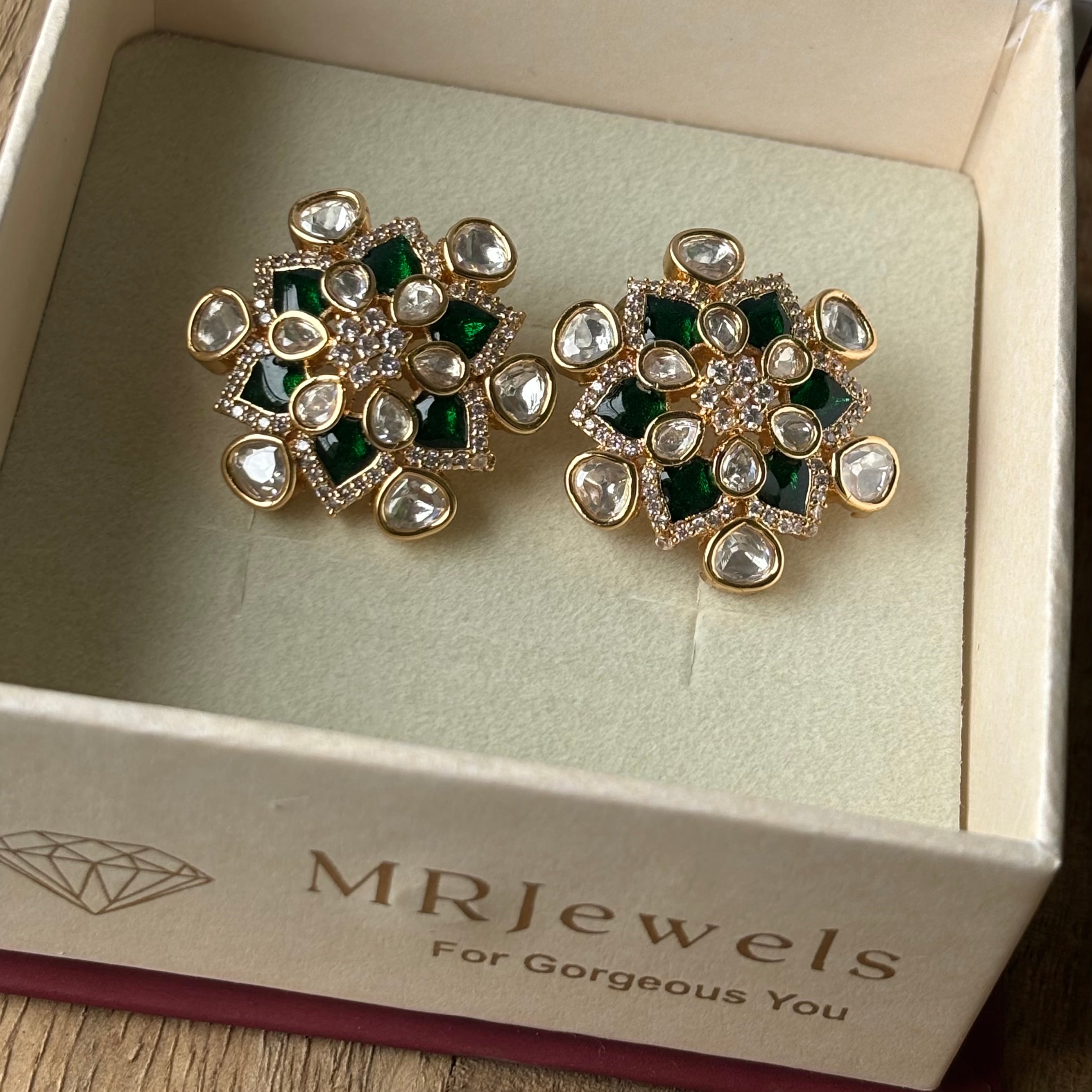 Rear view of kundan stud earrings with polished gold-toned backing