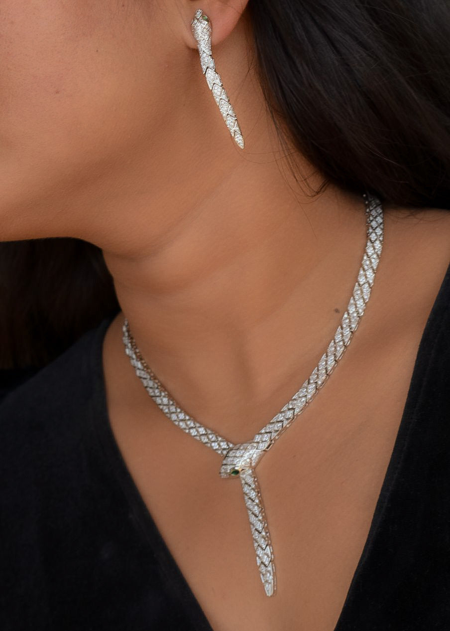 Close-up of diamond snake necklace with sleek design and sparkling gem accents